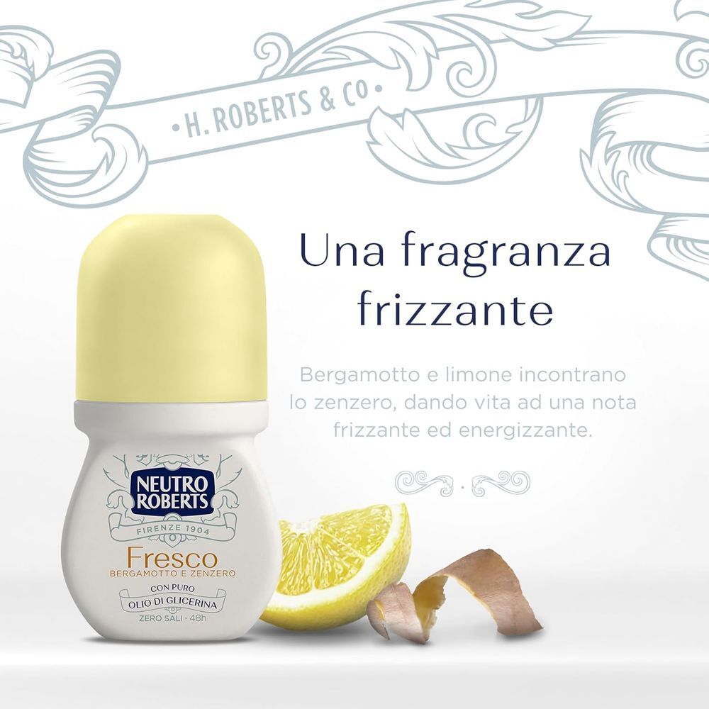Un deodorante roll-on Neutro Roberts Deo Fresco accanto a una fetta e scorza di limone.