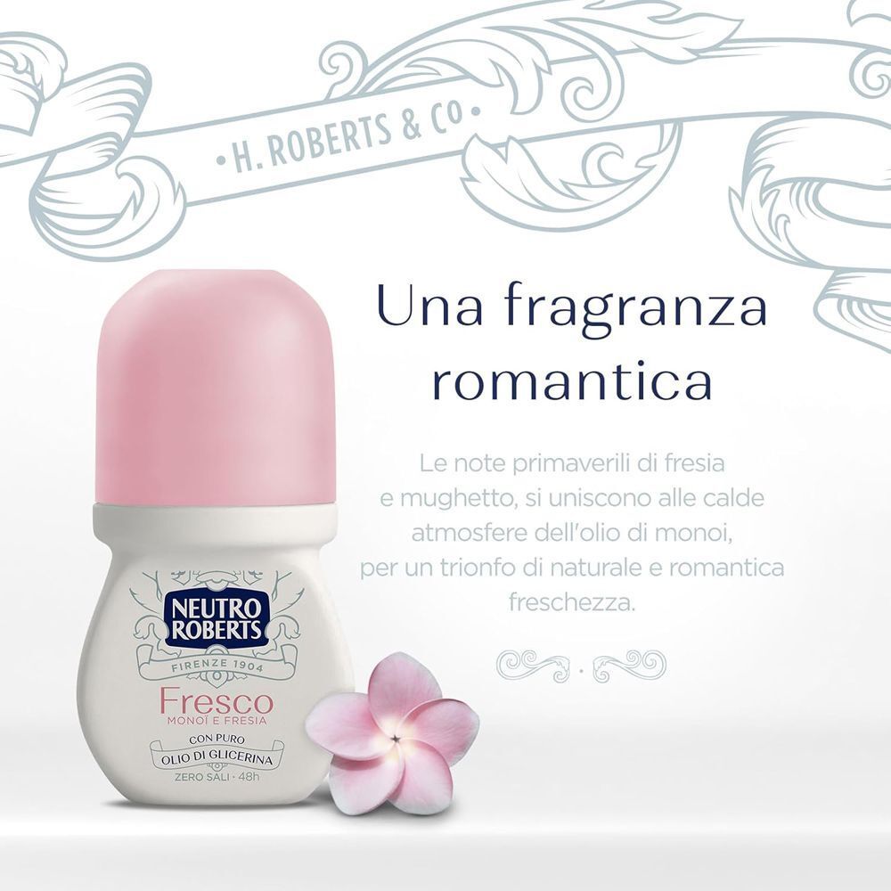 Un deodorante roll-on con tappo rosa e un fiore.
