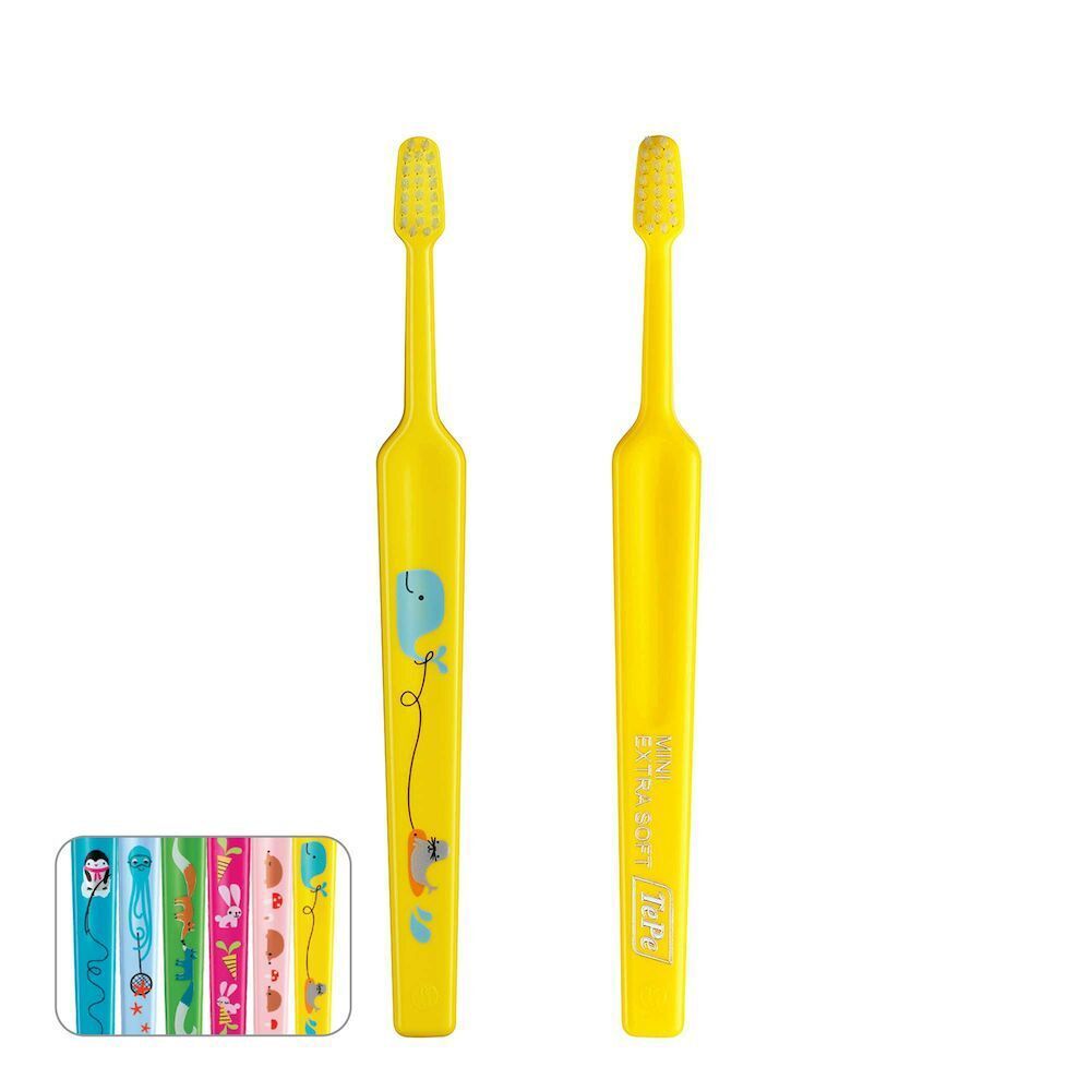 Spazzolino giallo per bambini con disegno di balena e setole morbide.