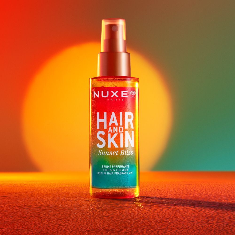 Spray profumato Nuxe Capelli e Pelle Sunset Bliss in bottiglia con erogatore spray, 100ml.