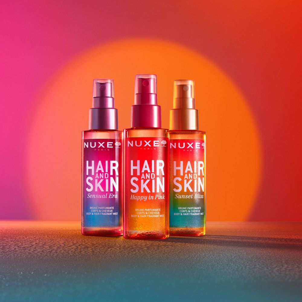 Tre spray profumati Nuxe Capelli e Pelle: Sunset Bliss, Happy in Pink, Sensual Era.
