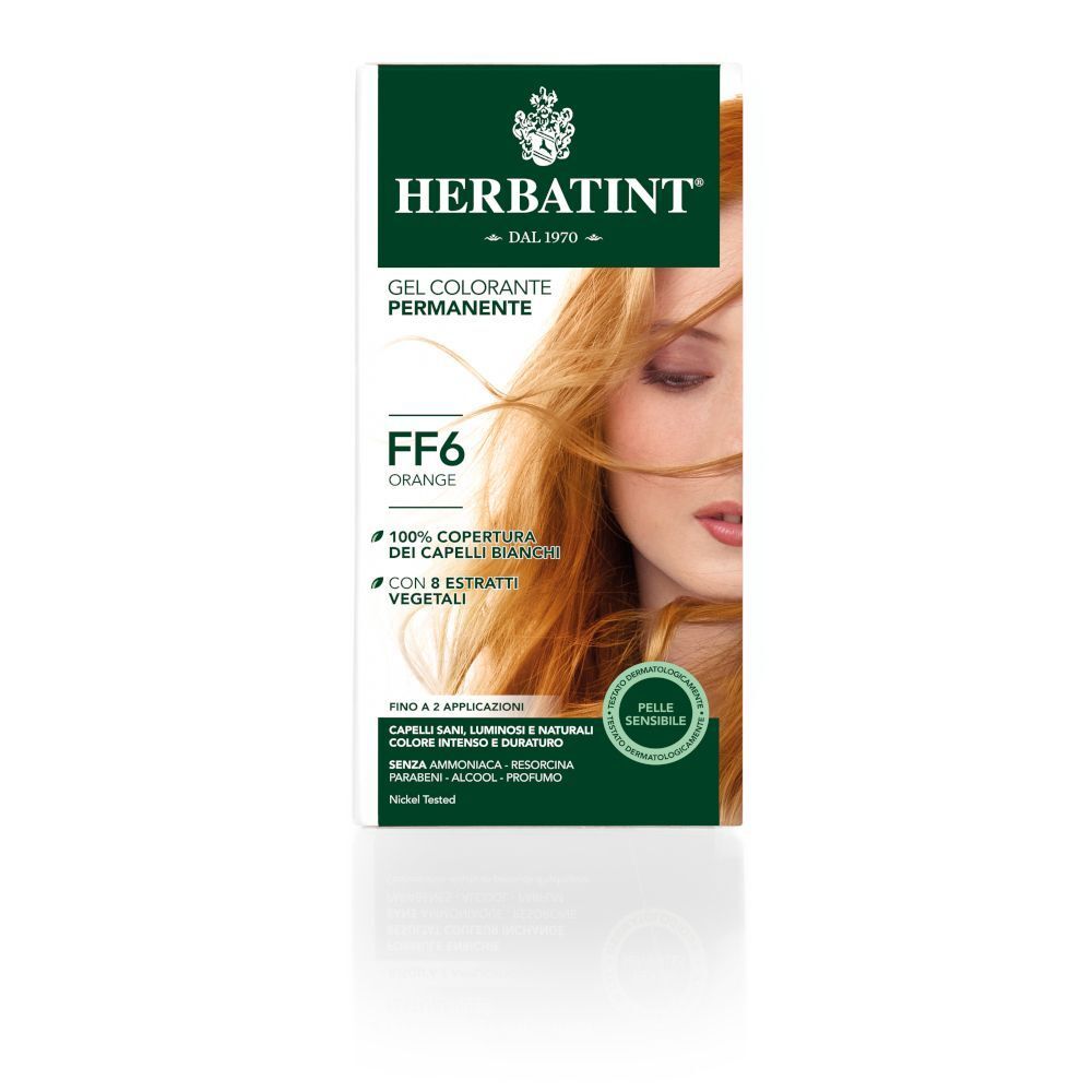 Confezione di tintura per capelli HERBATINT® FF6 Orange. Confezione verde e bianca con immagine di donna dai capelli arancioni.