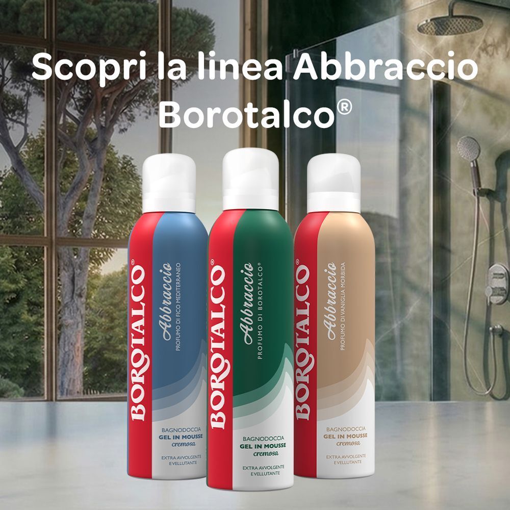Tre flaconi Borotalco gel in mousse doccia di diversi colori in una doccia.