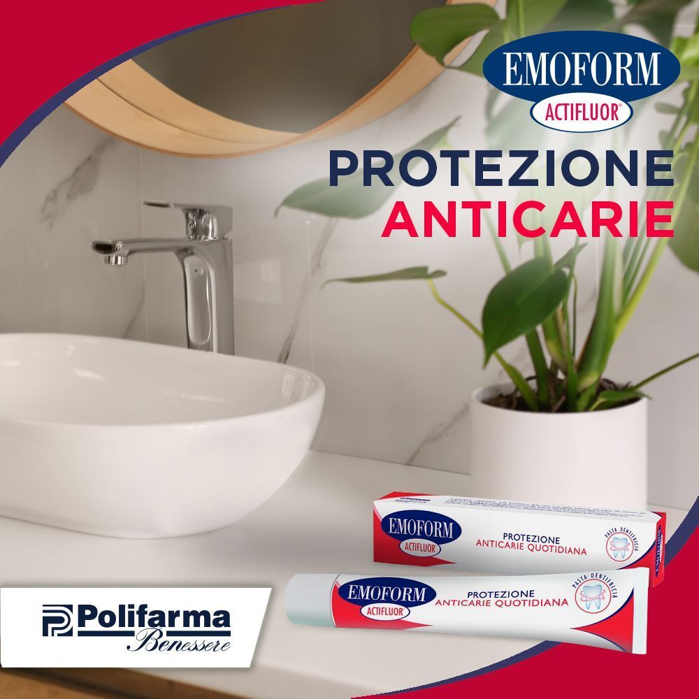 Tubetto e scatola di dentifricio EMOFORM Actifluor in un bagno vicino a un lavandino.
