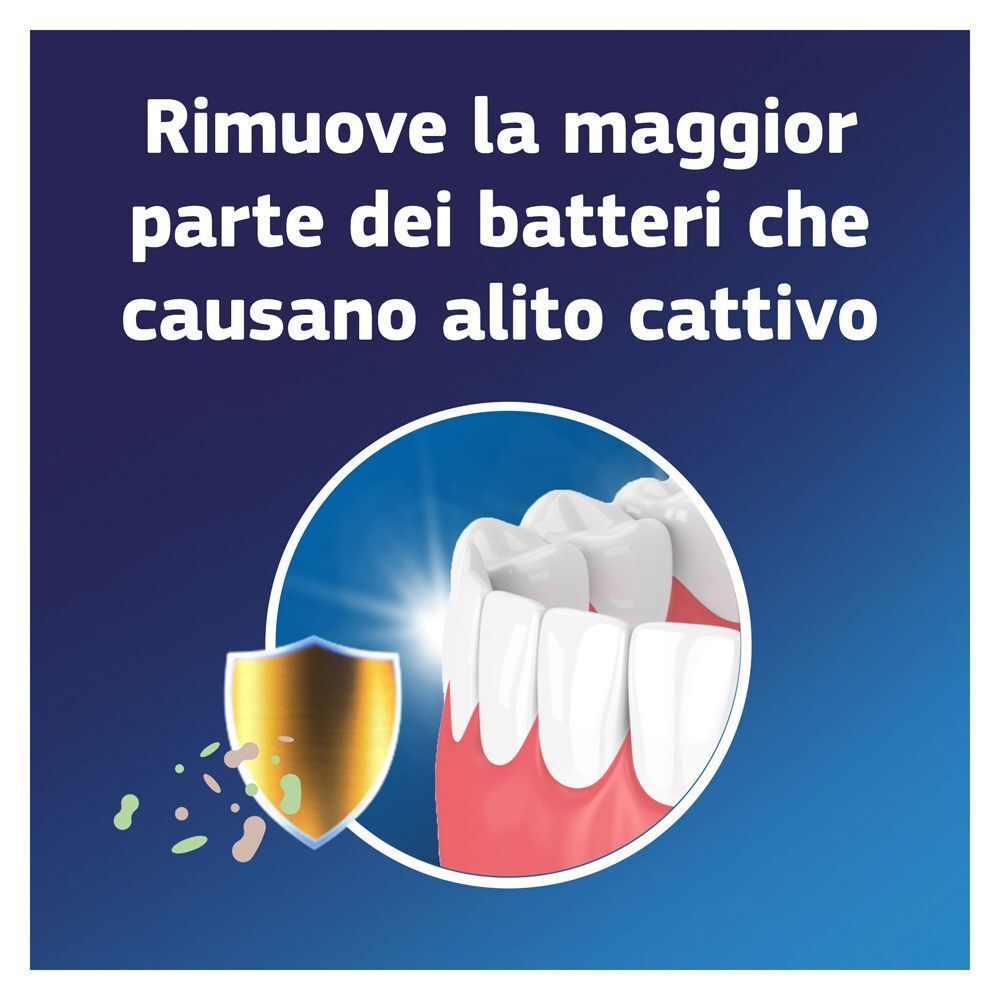 Dentiere davanti a uno scudo con batteri che causano l'alito cattivo.
