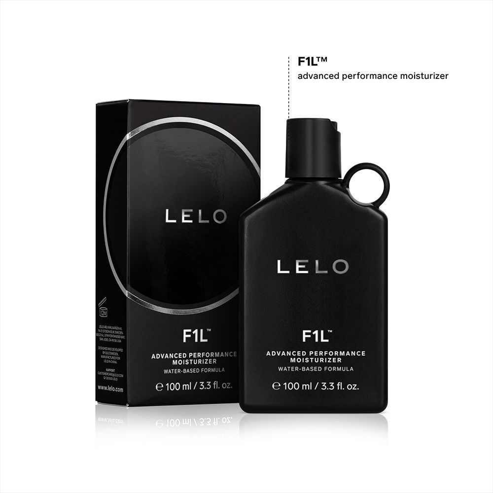 Flacone di lubrificante Lelo F1L accanto alla sua confezione nera.