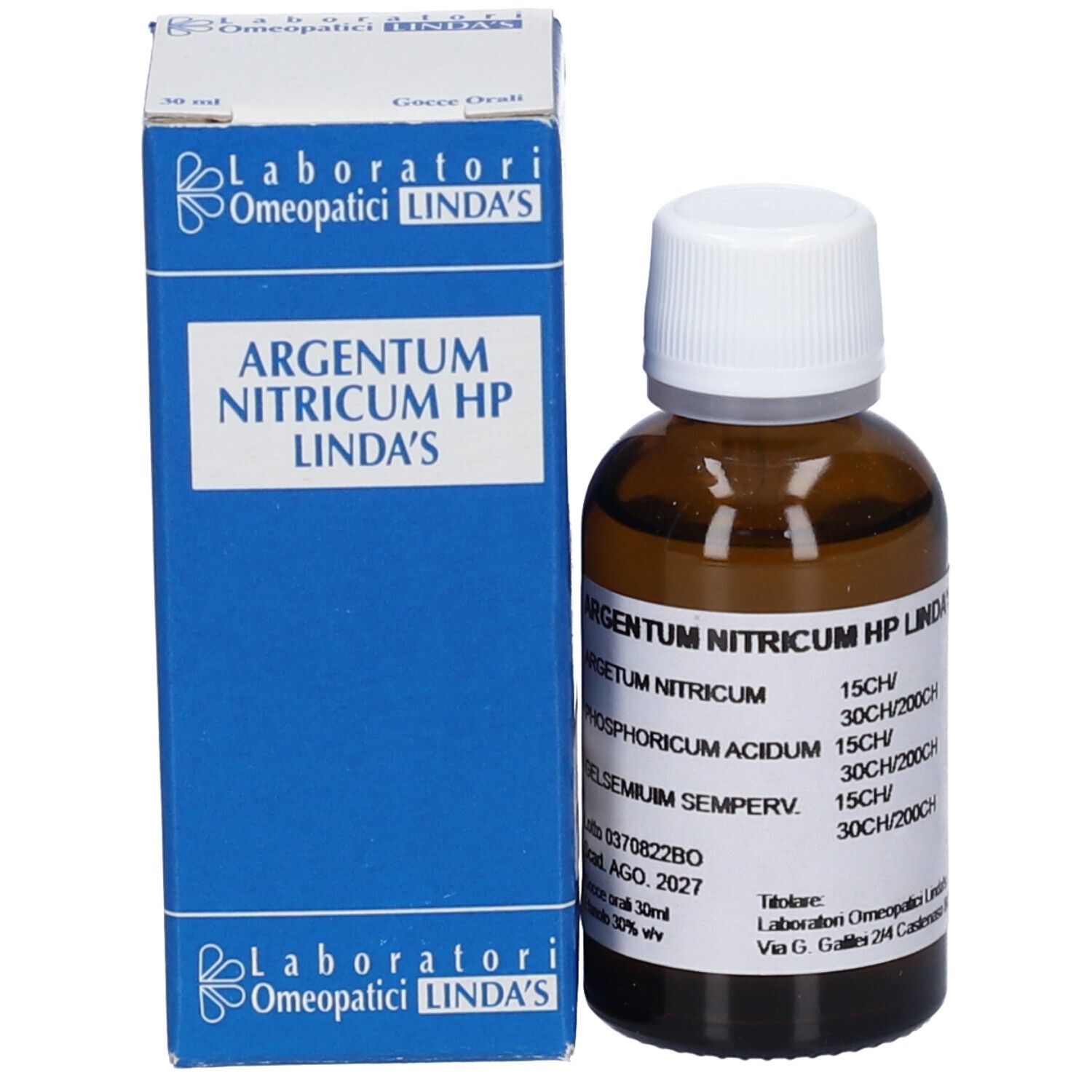 Scatola blu e flacone di vetro marrone con tappo bianco. Scritta: Argentum Nitricum HP Linda's. Bottiglia accanto.