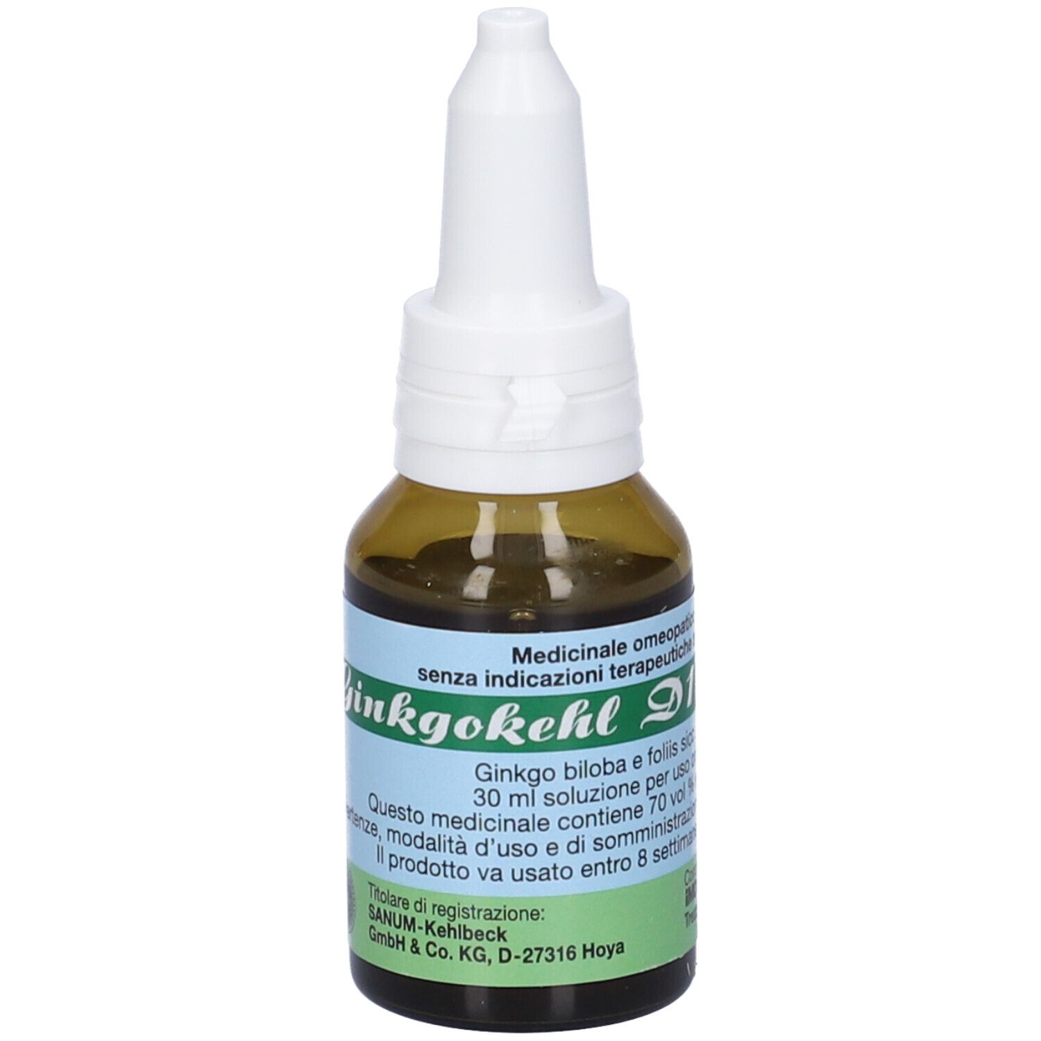 Flacone di vetro marrone con contagocce bianco. Etichetta con testo. Nome prodotto: Ginkgokehl D1.