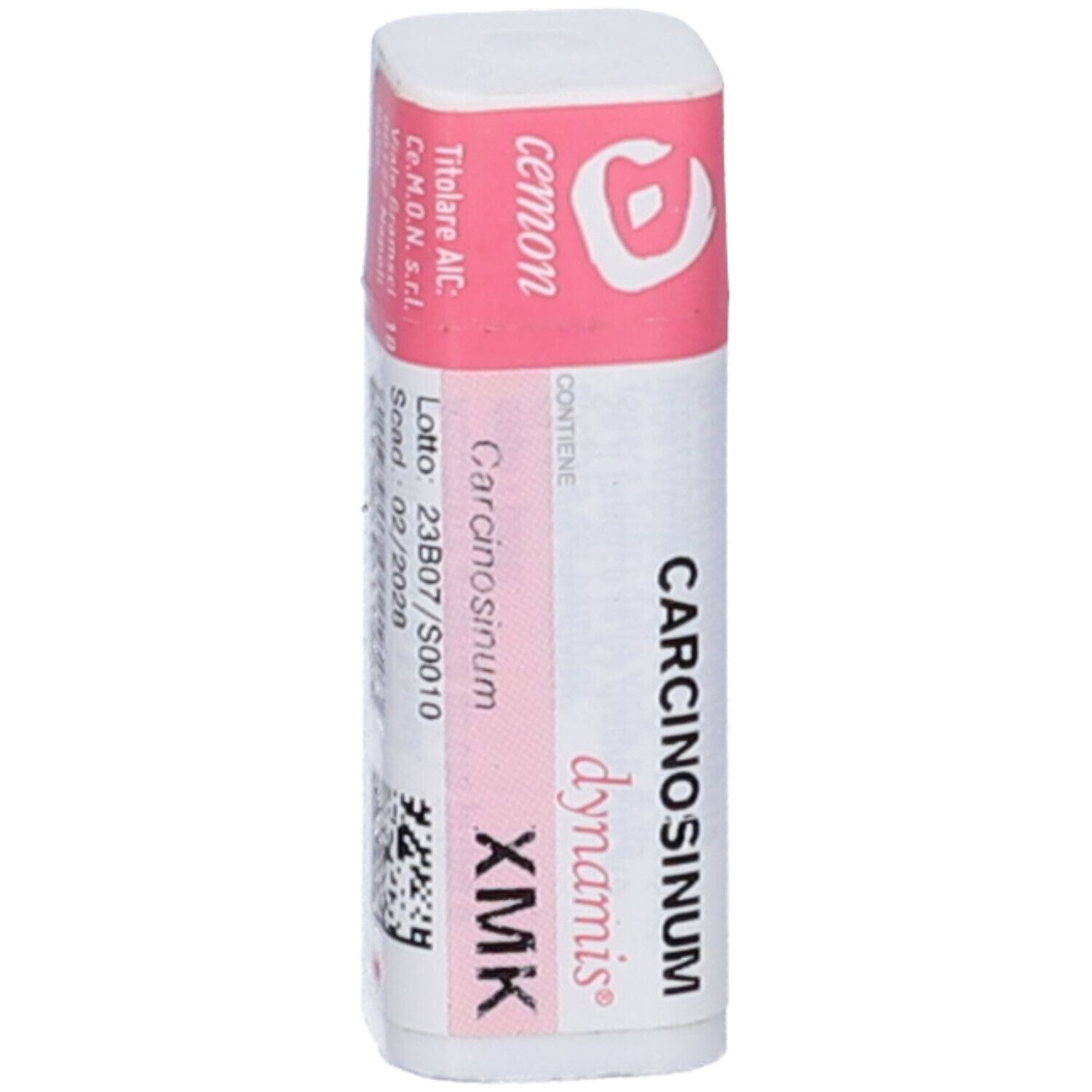 Confezione cilindrica con etichetta rosa. Scritta: Carcinosinum XMK, dynamis, cemon. Contiene granuli.