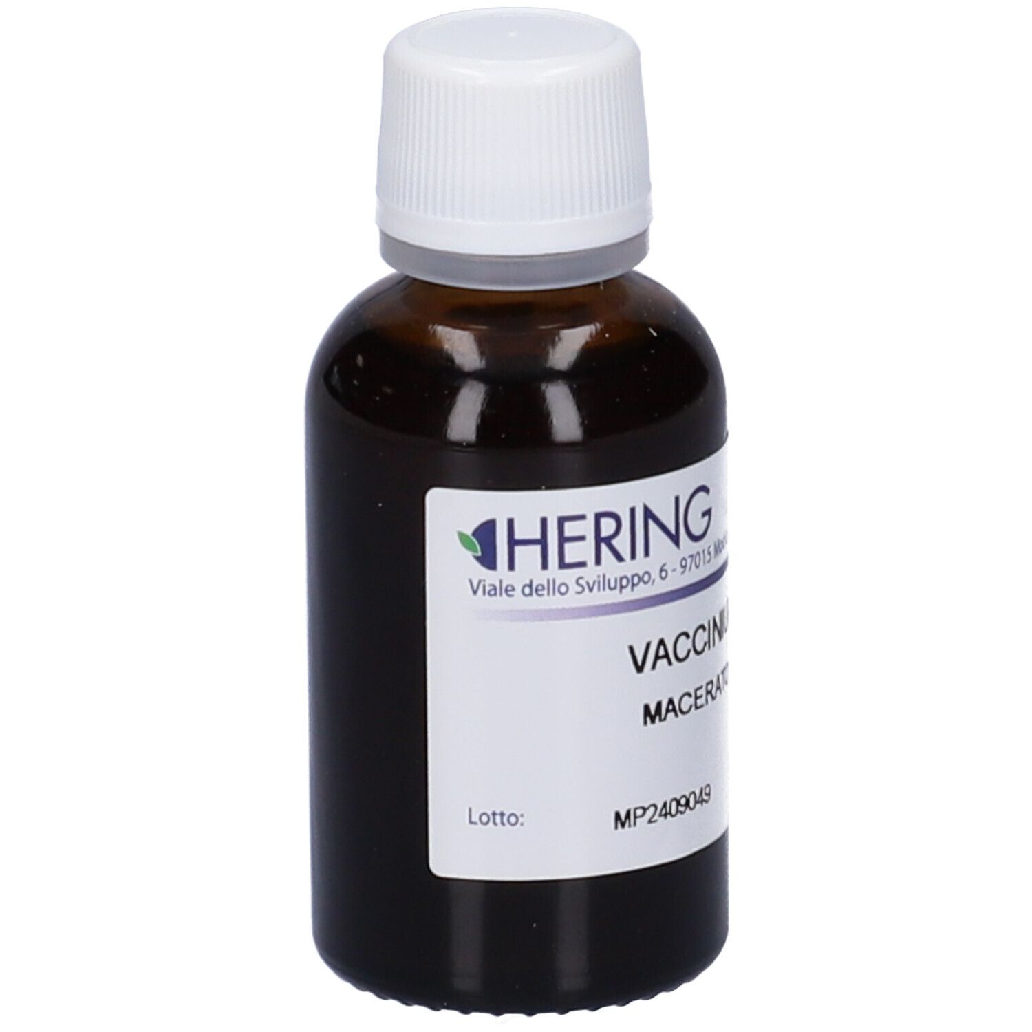 Flacone di vetro marrone con tappo bianco ed etichetta. Scritta: HERING, Vaccinium Vitis Idaea Macerato Glicerico. Numero di lotto.