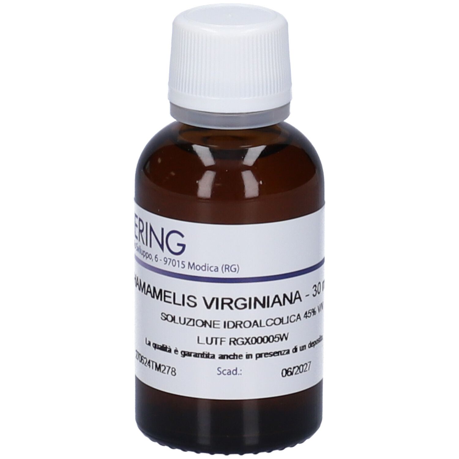 Flacone di vetro marrone con tappo bianco. Etichetta con nome del prodotto e produttore HERING. Testo: HAMAMELIS VIRGINIANA - 30 ml.