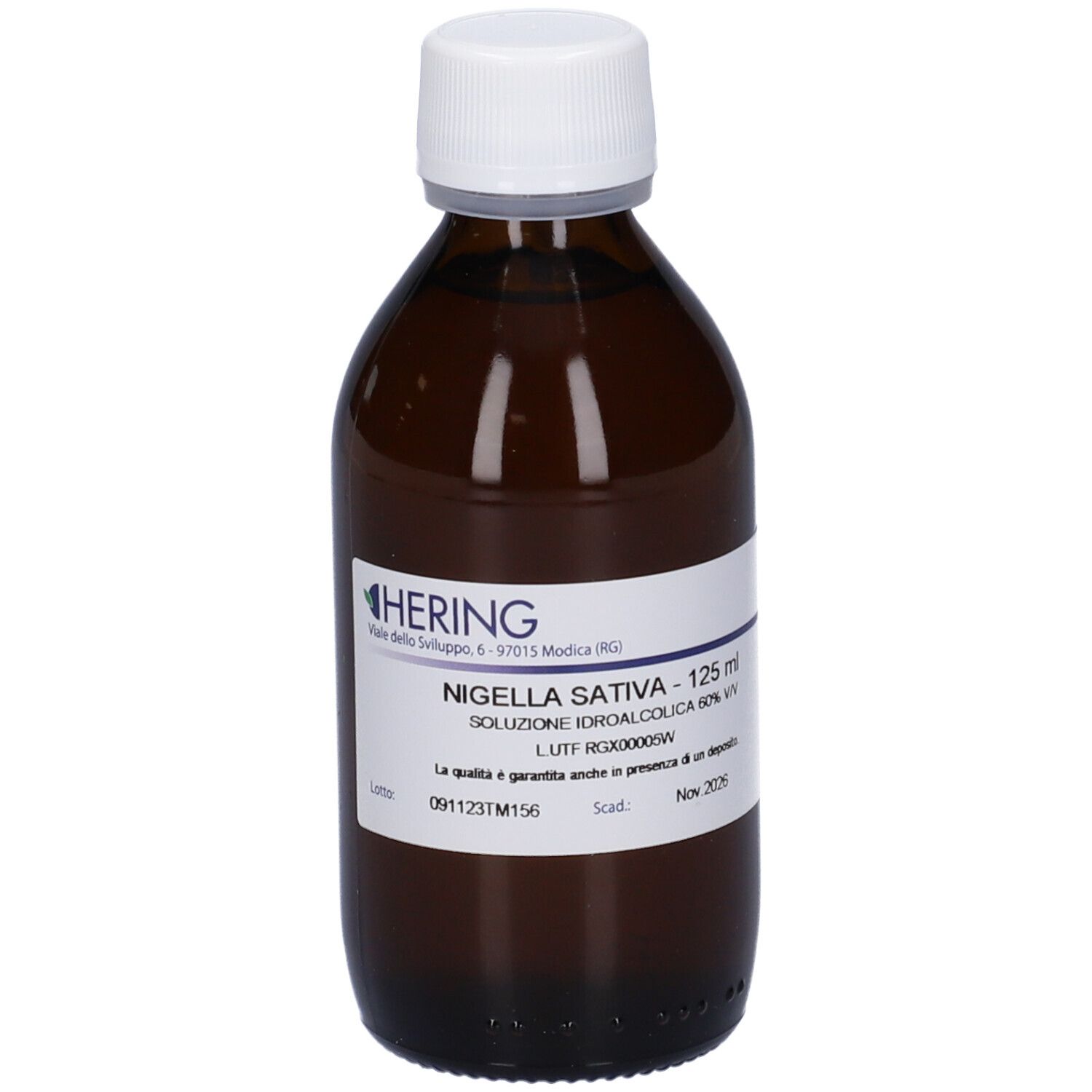 Flacone di vetro marrone con tappo bianco. Etichetta con testo: HERING, Nigella Sativa, 125 ml. Scritta in italiano.