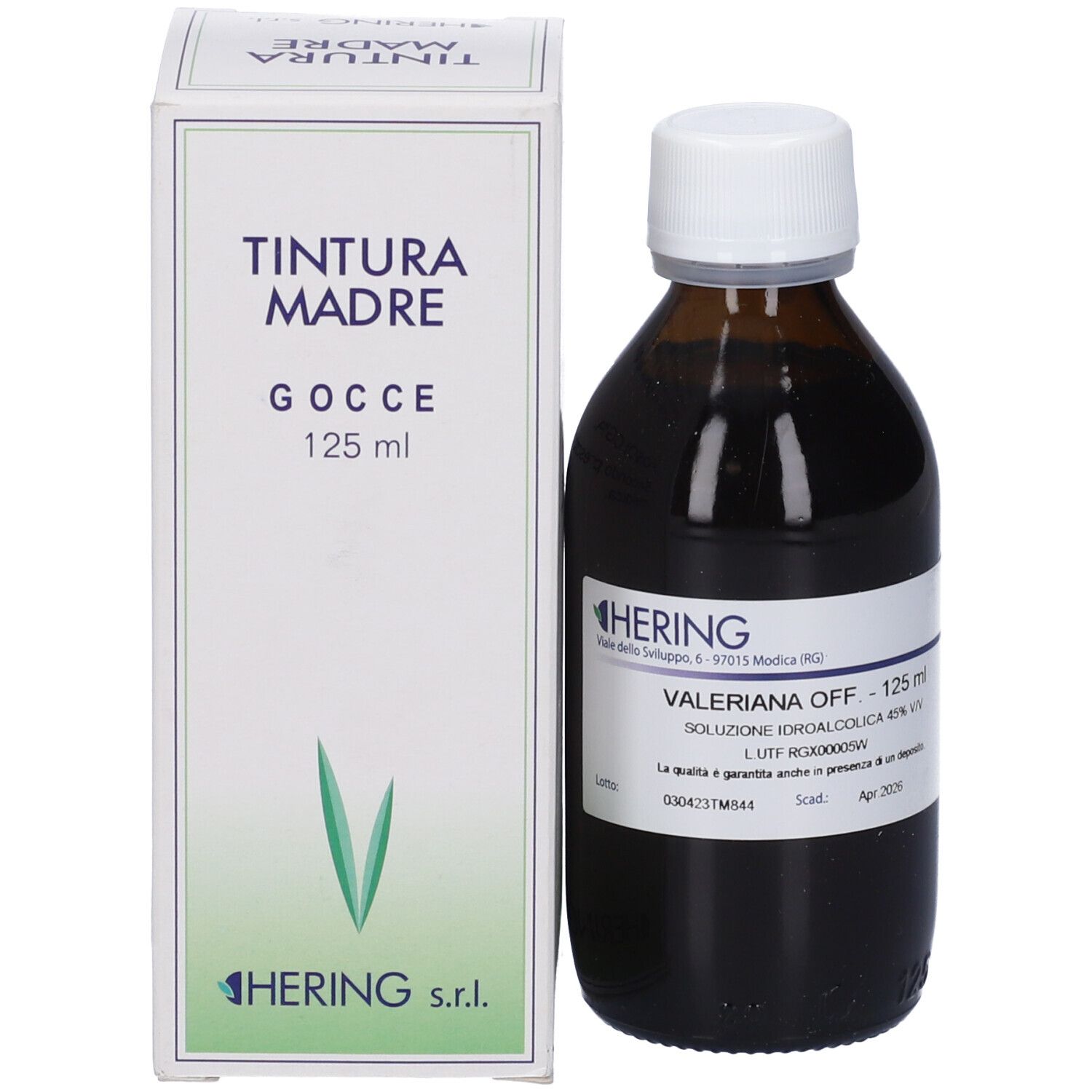 Flacone di vetro marrone con tappo bianco ed etichetta, accanto a una scatola bianca. Sulla scatola c'è scritto 'TINTURA MADRE'.