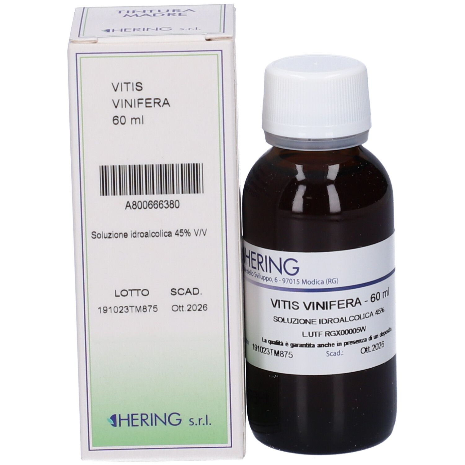 Flacone di vetro marrone con tappo bianco ed etichetta, accanto a una scatola bianca. Scritta: Vitis Vinifera, 60 ml. Marchio Hering.