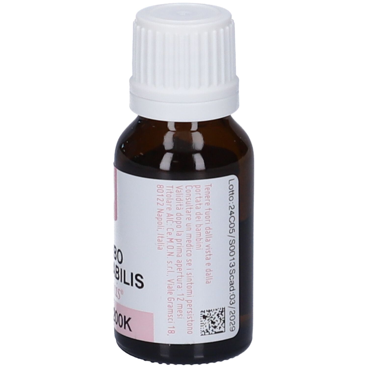 Flacone di vetro marrone con tappo bianco. Etichetta con testo e rosa. Lotto e scadenza: 03/2029.