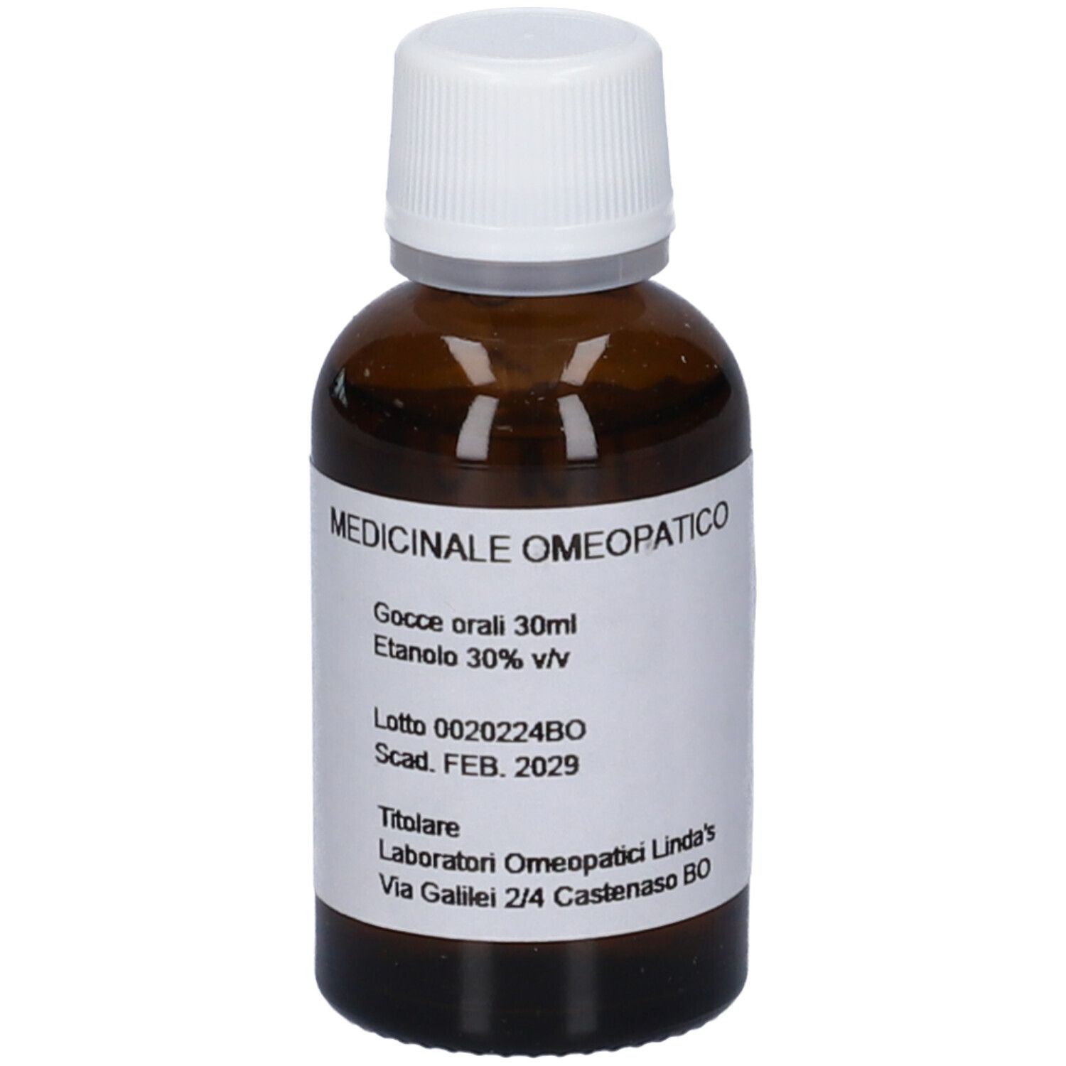 Flacone di vetro marrone con tappo bianco. Etichetta con nome del prodotto e altre informazioni.