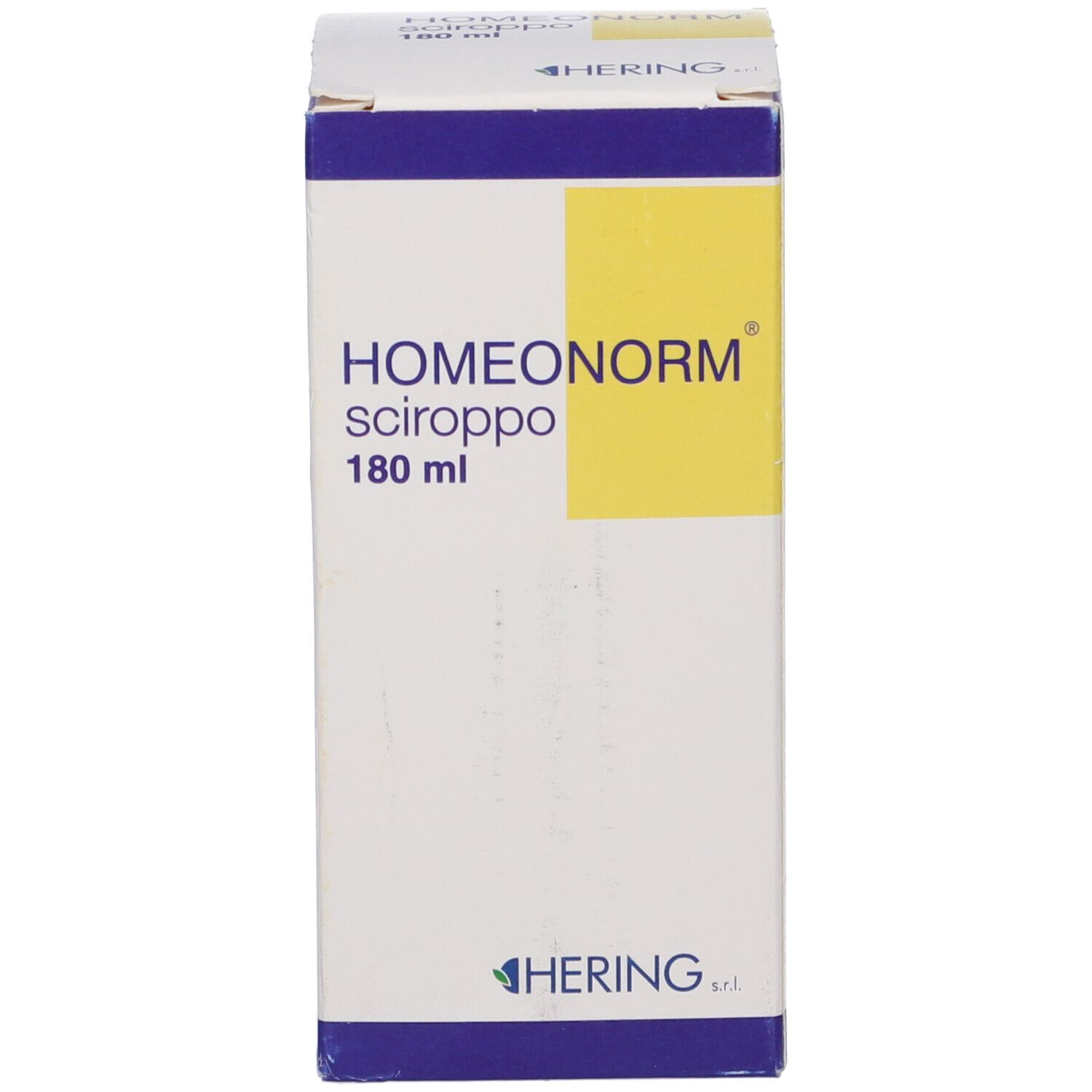 Scatola con HOMEONORM Sciroppo. Scritta: HERING. Etichetta gialla. 180 ml.