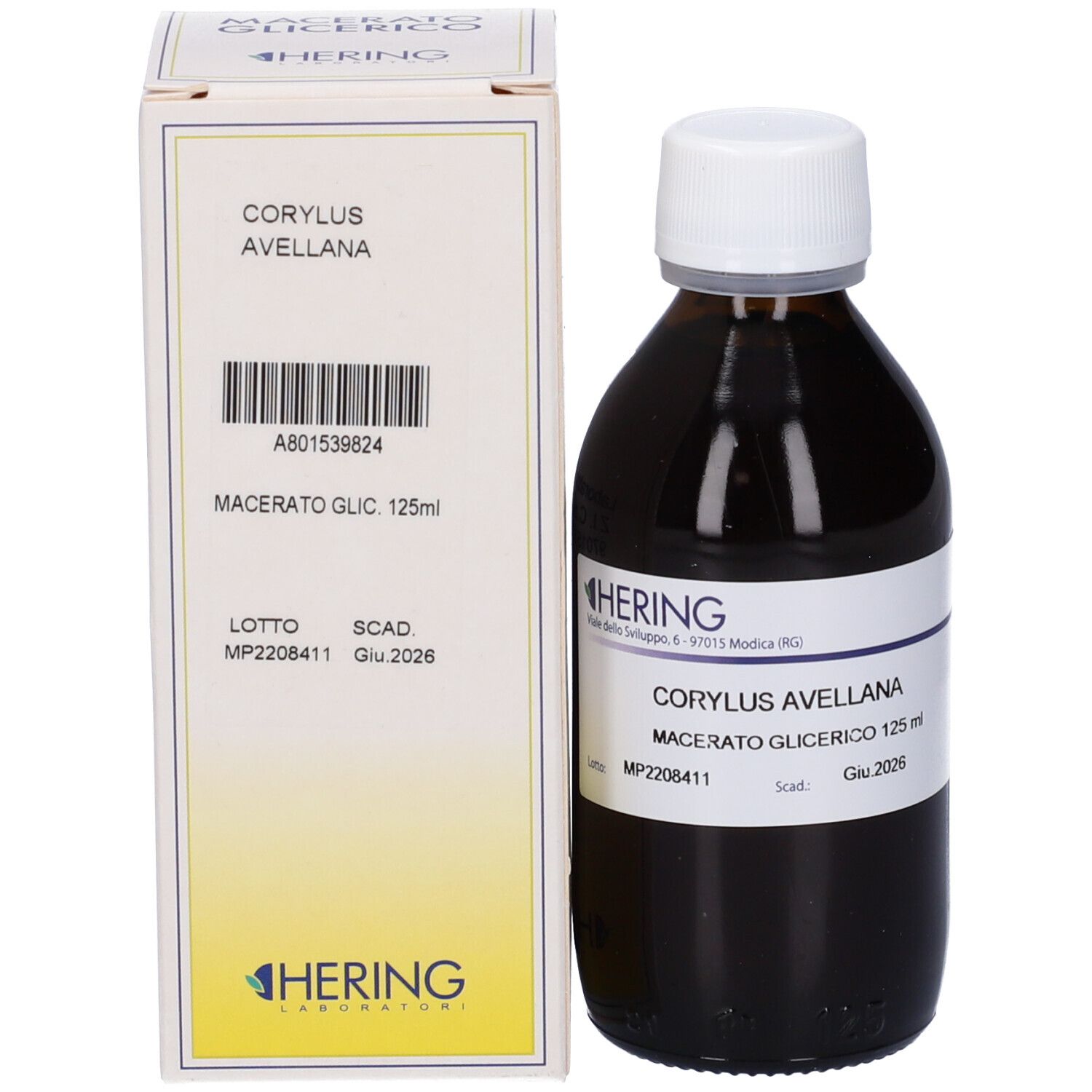 Flacone di vetro marrone con tappo bianco e confezione in cartone. Scritta: Corylus Avellana Macerato Glicerico. Logo del produttore.