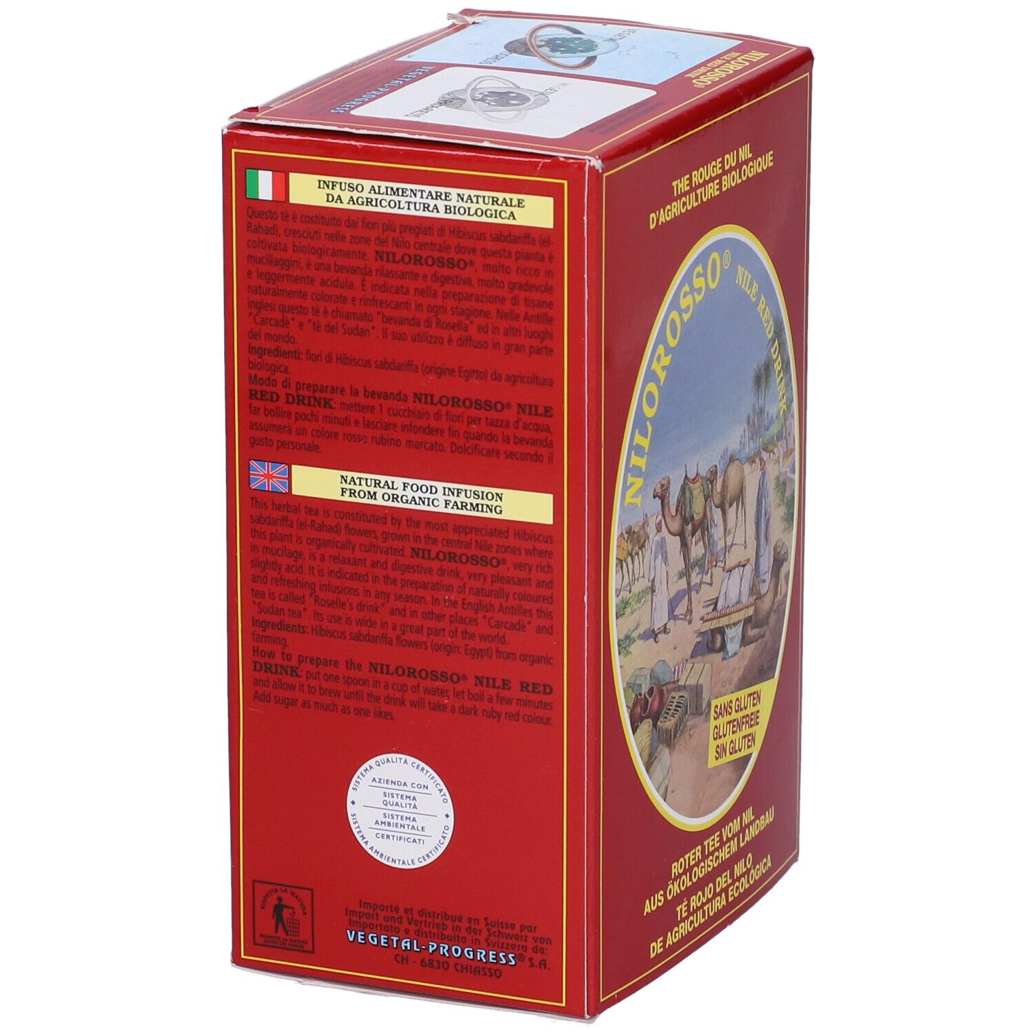 Vista laterale di una scatola rossa. Testo in inglese, italiano e tedesco. "Nilorosso Nile Red Drink" è visibile.