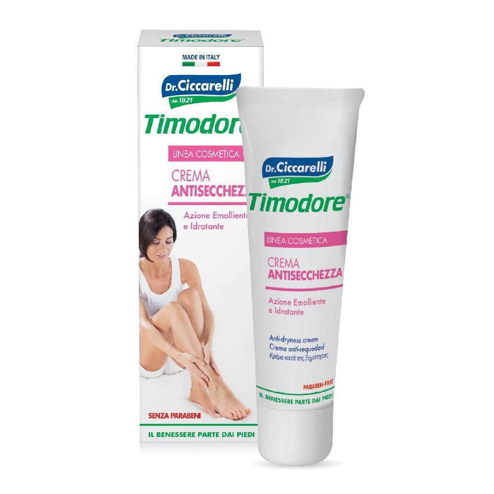 Tubo e scatola di crema. Scritta: Timodore, Crema Antisecchezza. Donna tocca il piede. Senza parabeni.