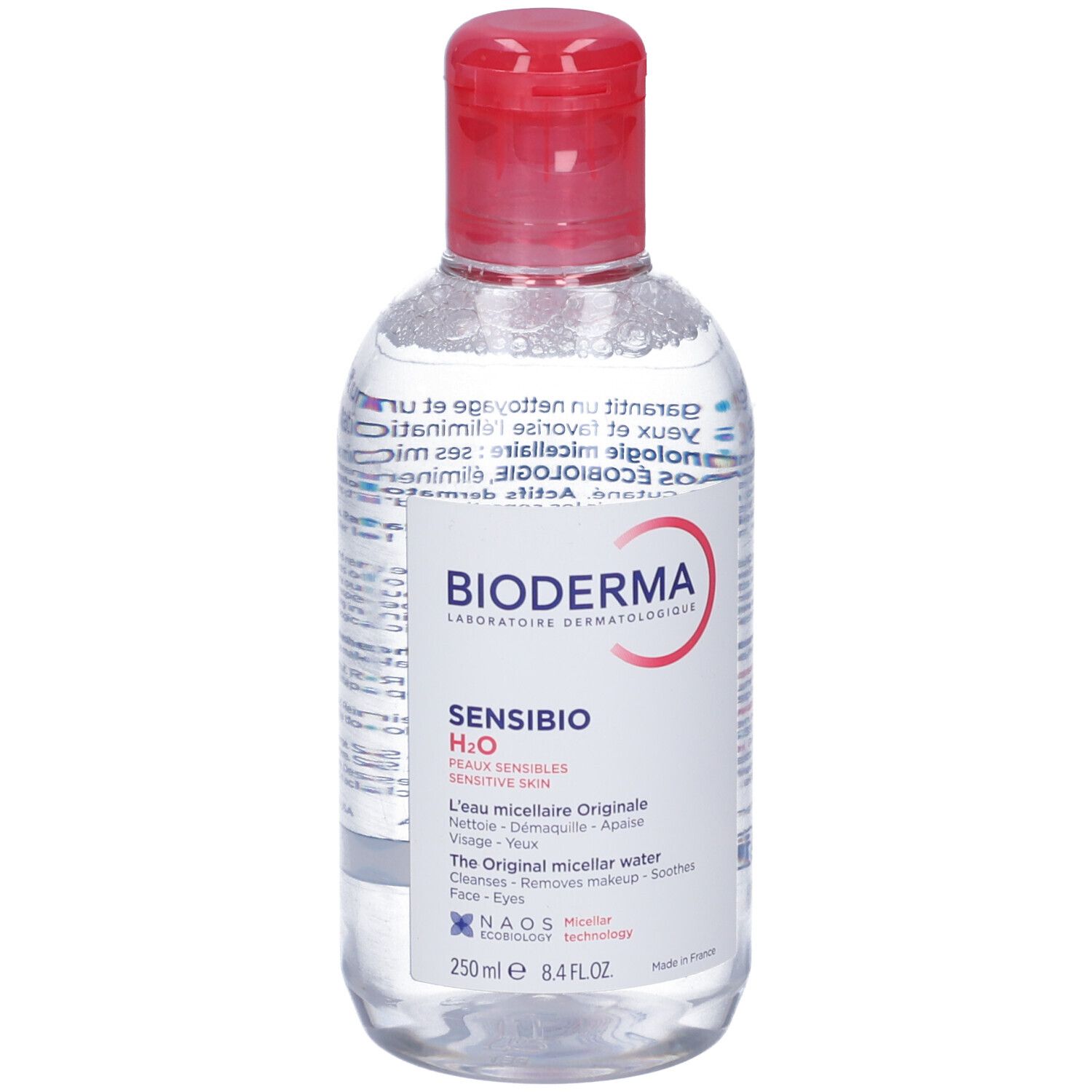Flacone trasparente con tappo rosso. Scritte: BIODERMA, Sensibio H2O, per pelli sensibili. Acqua micellare.