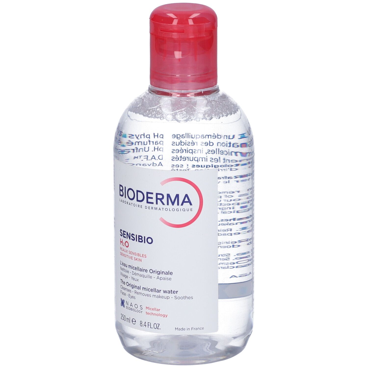 Flacone trasparente con tappo rosso. Scritte: BIODERMA, Sensibio H2O, per pelli sensibili. Acqua micellare.