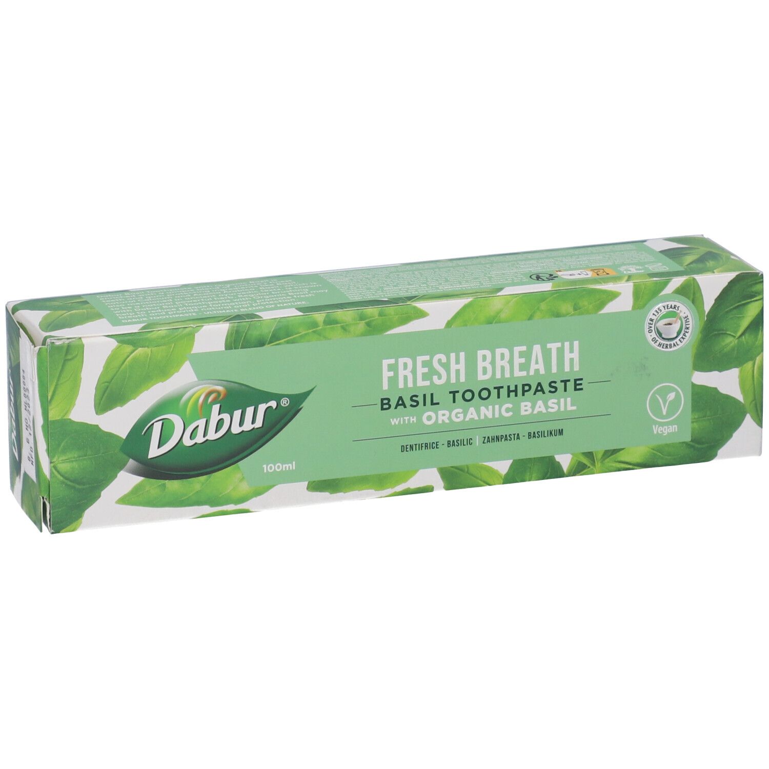 Confezione di dentifricio "Dabur Herbal" al basilico. Scatola turchese e bianca con nome e logo.