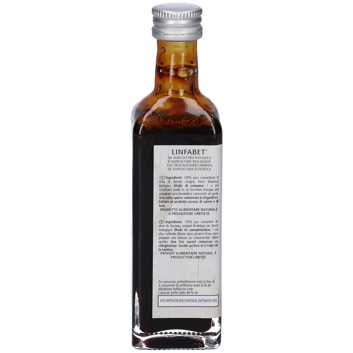 Retro di una bottiglia di vetro con liquido marrone. Testo sull'etichetta. Tappo argentato.