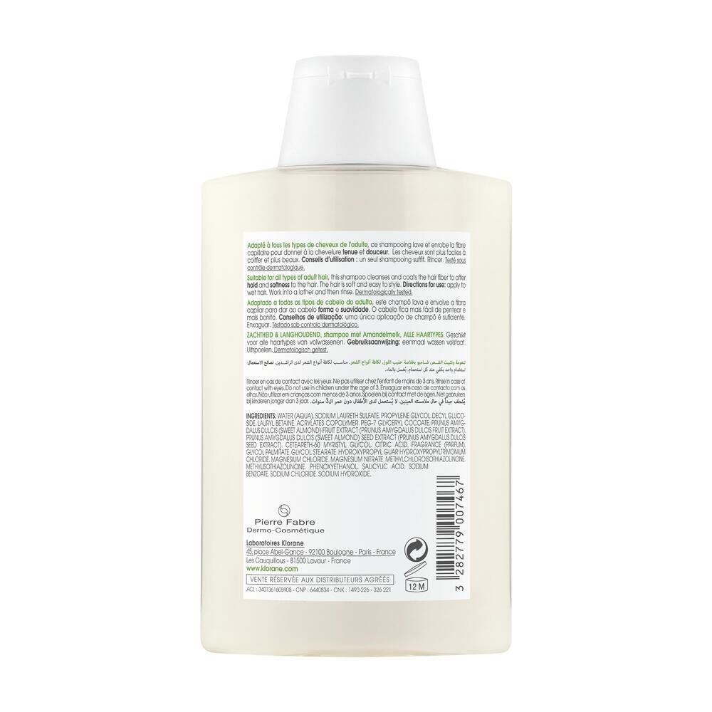 Retro della bottiglia di shampoo KLORANE al latte di mandorla. Testo multilingue, ingredienti, informazioni produttore.