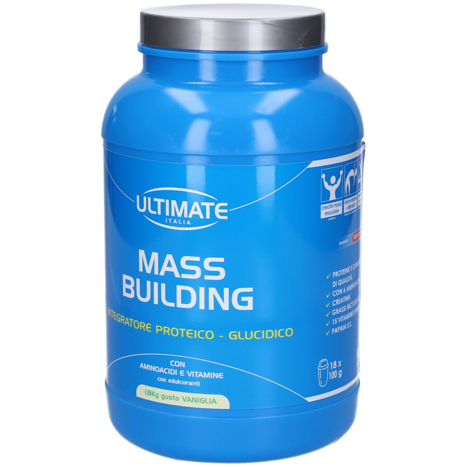 Barattolo blu con coperchio argentato. Scritta: Ultimate Italia, Mass Building, Integratore Proteico - Glucidico. 18 x 100 g. Con icone.