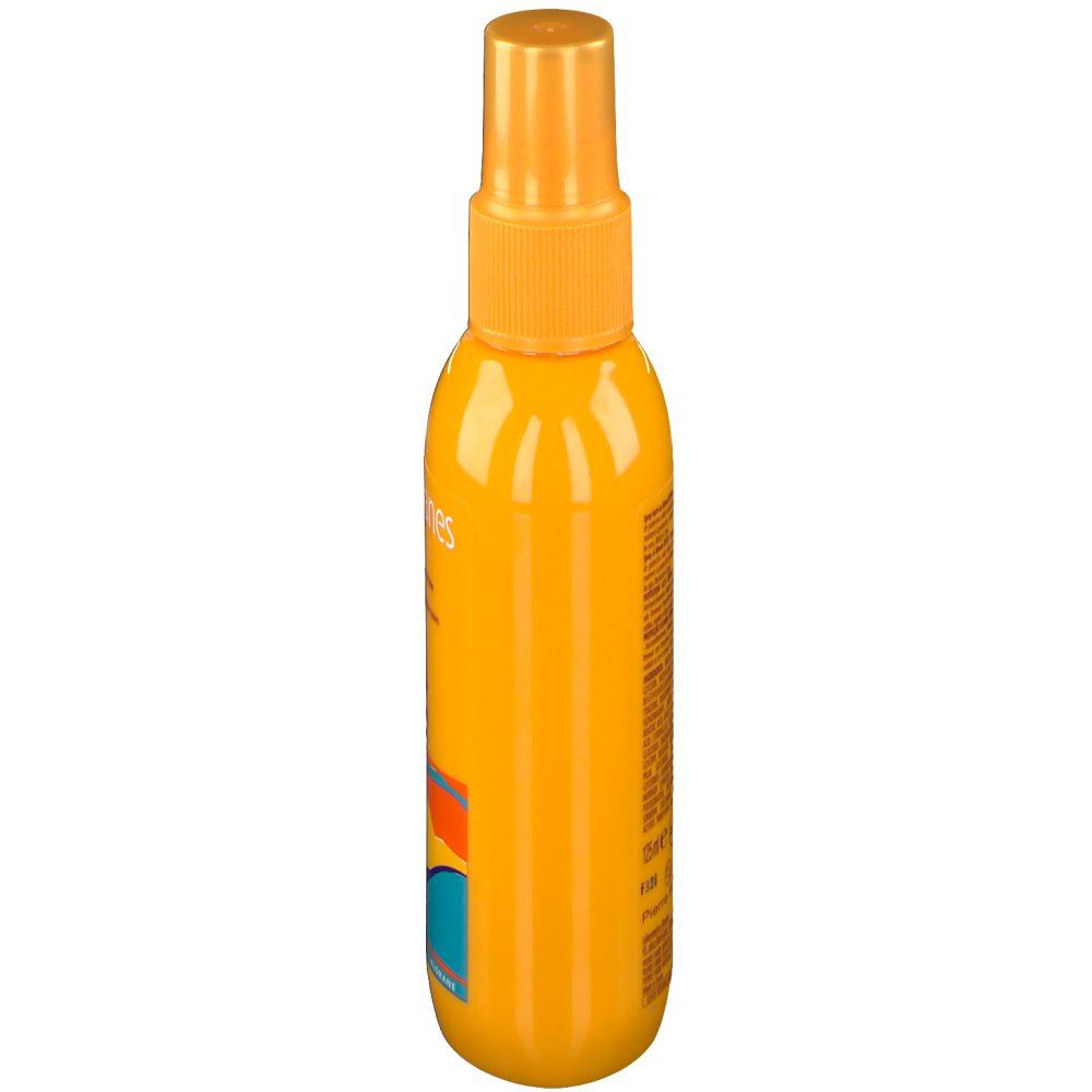 Flacone spray giallo, vista laterale. Scritta illeggibile. Motivi a onde colorate in basso.