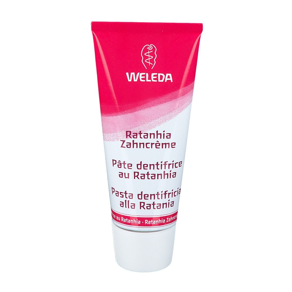 Tubo di dentifricio rosa e bianco. Scritte: WELEDA, Ratanhia Zahncrème, Pâte dentifrice au Ratanhia, Pasta dentifricia alla Ratania.