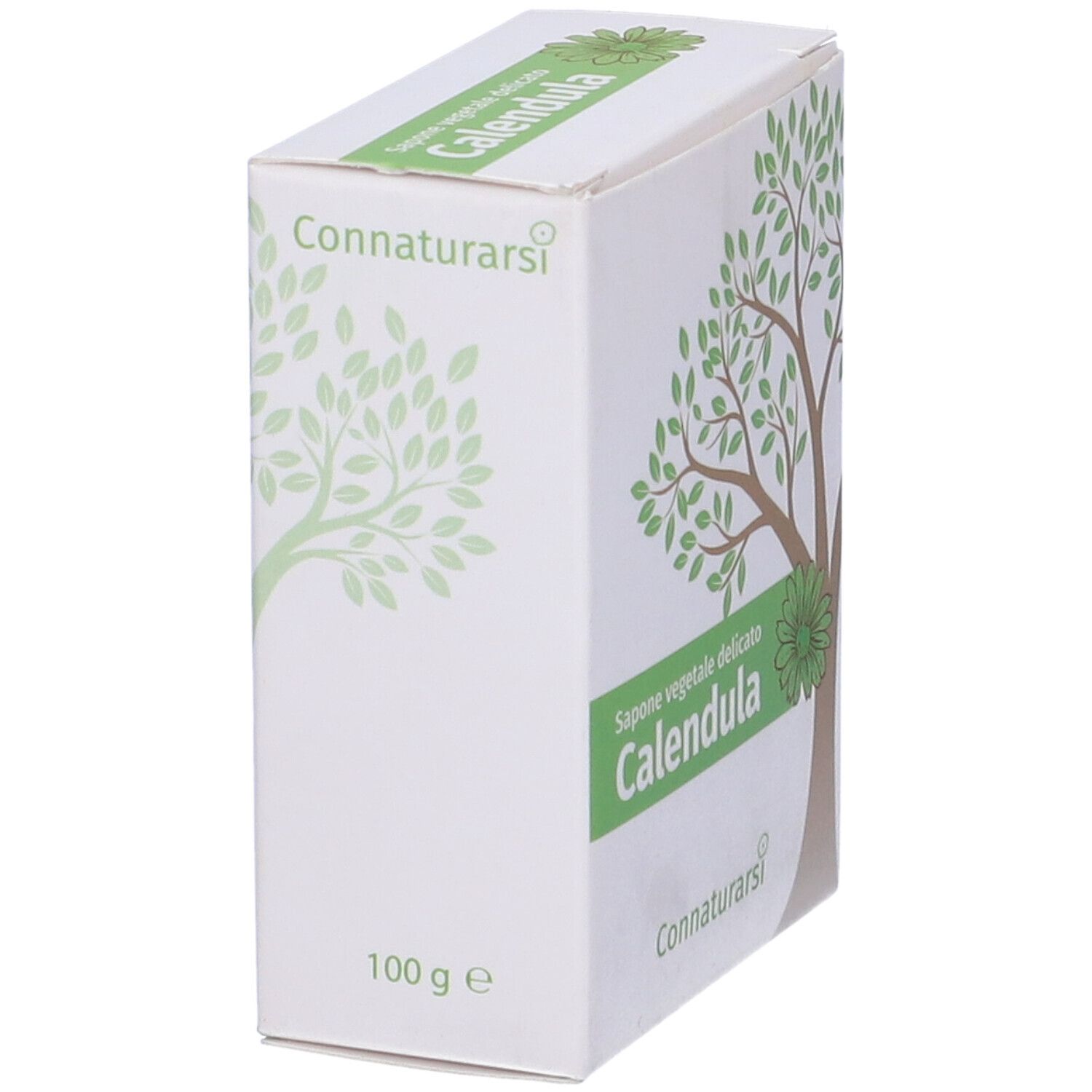 Scatola bianca con disegno di albero verde e testo. "Calendula" in verde. Marchio: Connaturarsi. Scritta: "Sapone vegetale delicato".