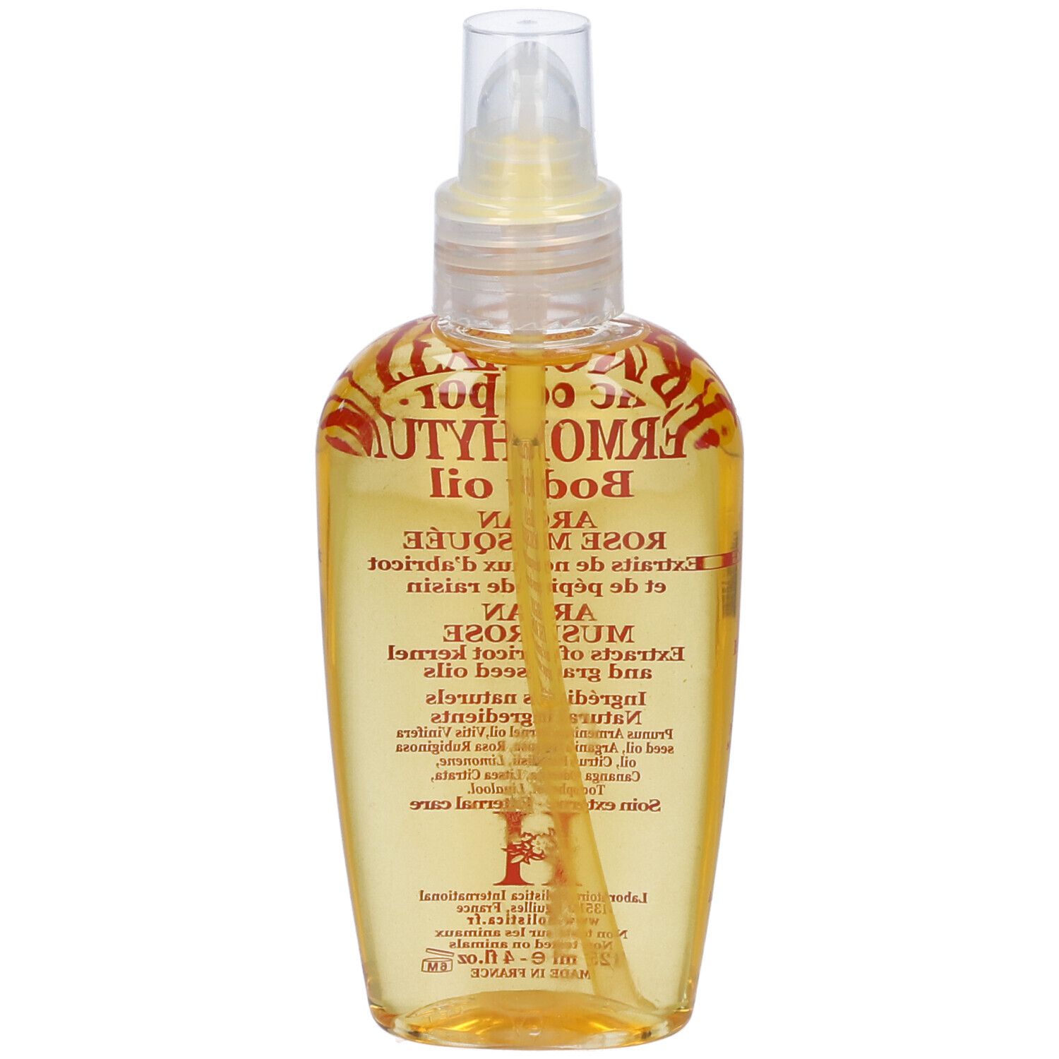 Flacone di olio per il corpo con vaporizzatore. Etichetta con nome e ingredienti. Liquido giallo visibile.