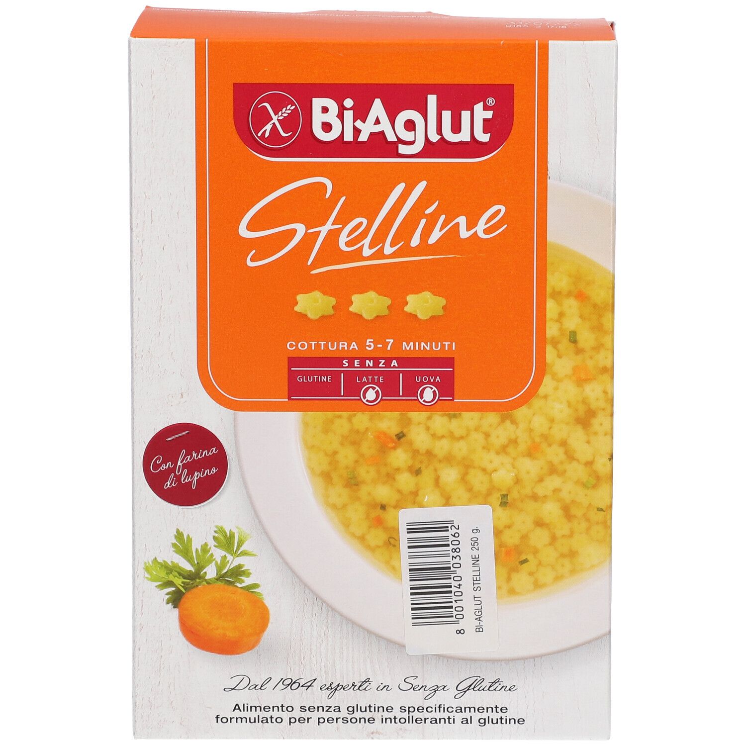 Scatola BiAglut Stelline s/uovo. Immagine del prodotto. Sfondo arancione. Senza glutine, latte e uova. Carota e prezzemolo.
