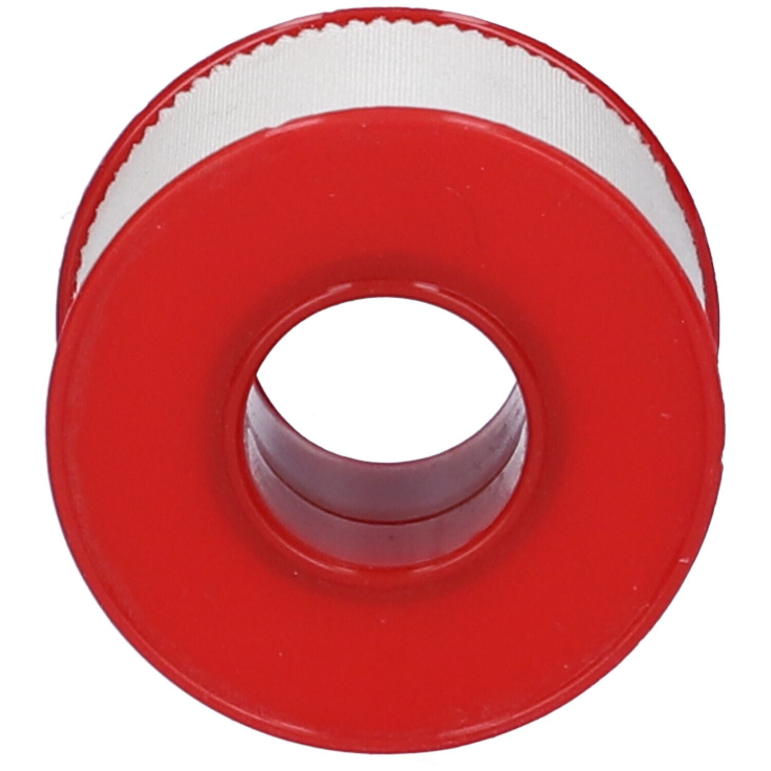 Rotolo di cerotto rosso con nastro bianco parzialmente srotolato.