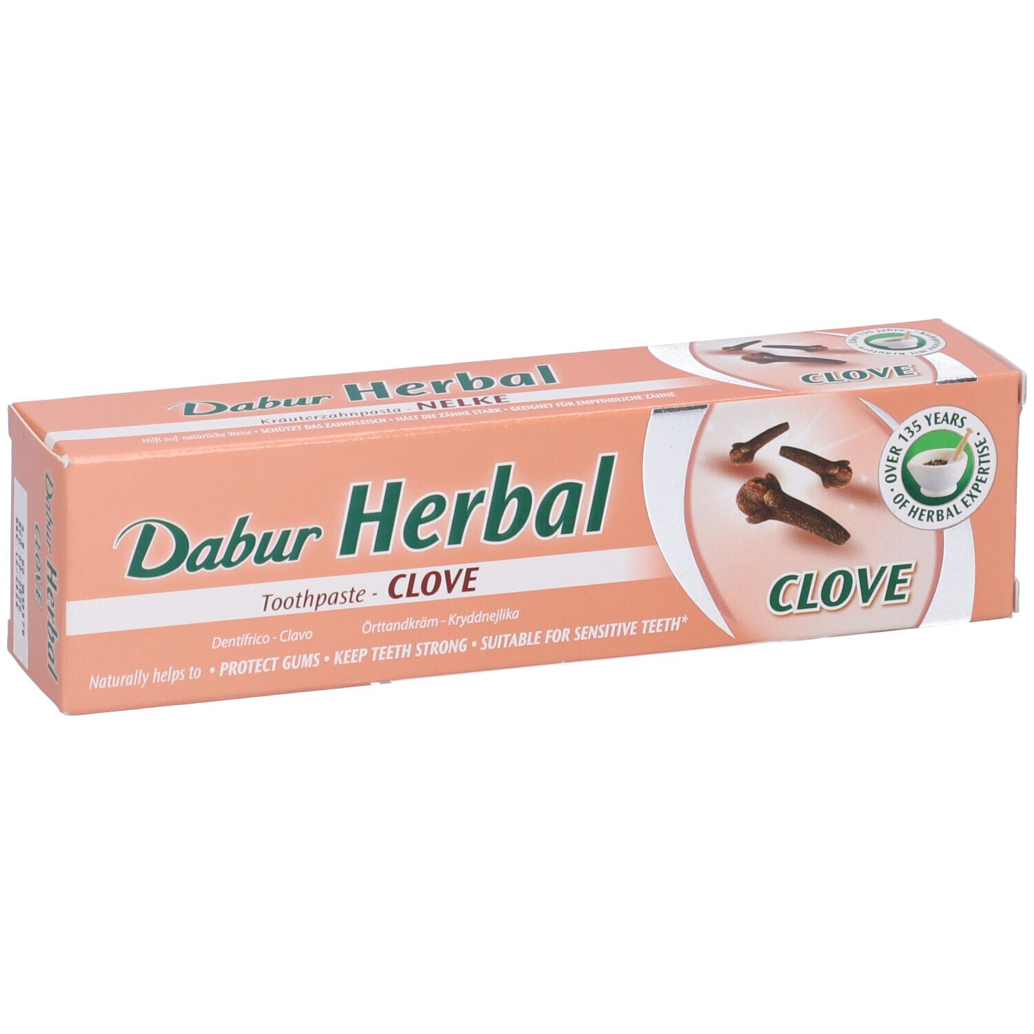Confezione di dentifricio con chiodi di garofano. Testo: Dabur Herbal, Clove. Sigillo verde: 125 anni di esperienza. Vista prospettica.