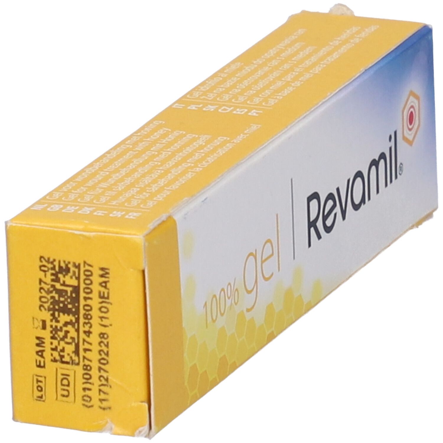 Confezione di gel giallo-bianca con nome e logo del prodotto. Scritta: 100% gel Revamil. Codice a barre e numero di lotto.