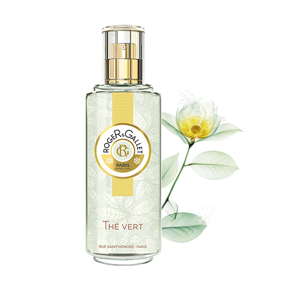 Flacone trasparente con vaporizzatore dorato. Logo e scritta. Profumo Thé Vert. Fiore bianco.