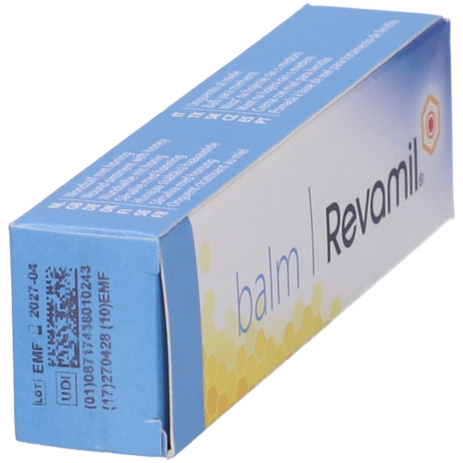 Confezione inclinata Revamil Balm. Testo: balm, Revamil. Codice e numero di lotto.