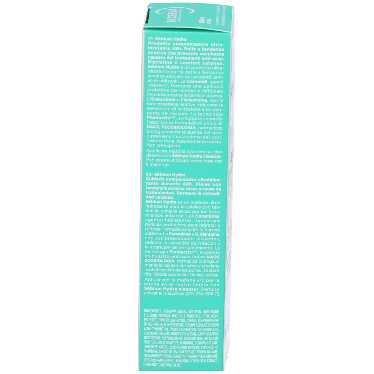 Lato della scatola. Testo multilingue. Contiene informazioni sul prodotto.