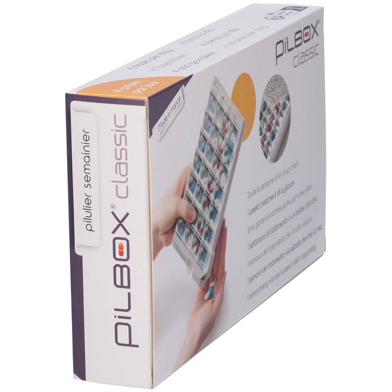 Confezione di Pilbox Classic. Scritto: pilulier semainier. Portapillole in mano. Confezione angolare.