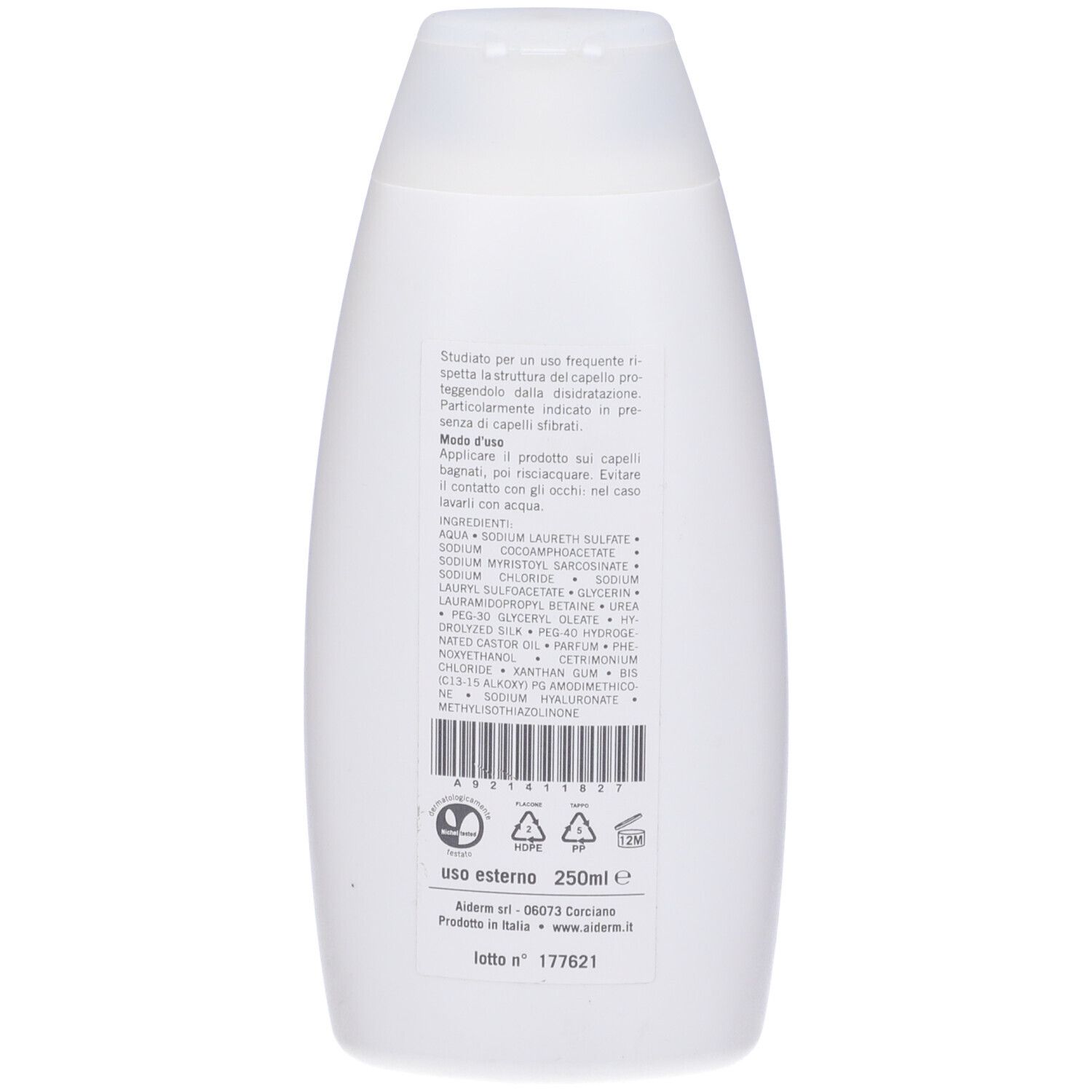 Retro di un flacone di shampoo bianco. Testo con ingredienti e istruzioni per l'uso. Scritta: Aiderm.