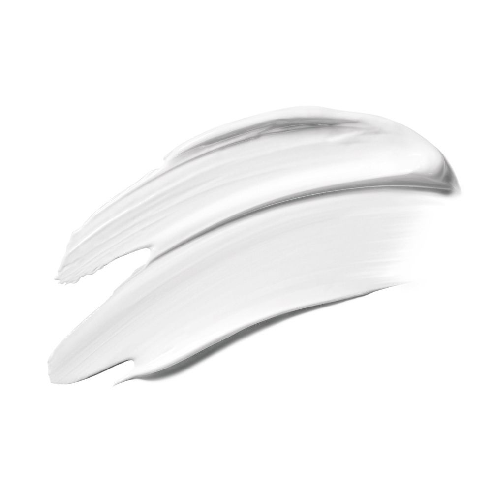 Traccia di balsamo bianco. Texture liscia. Su sfondo bianco.