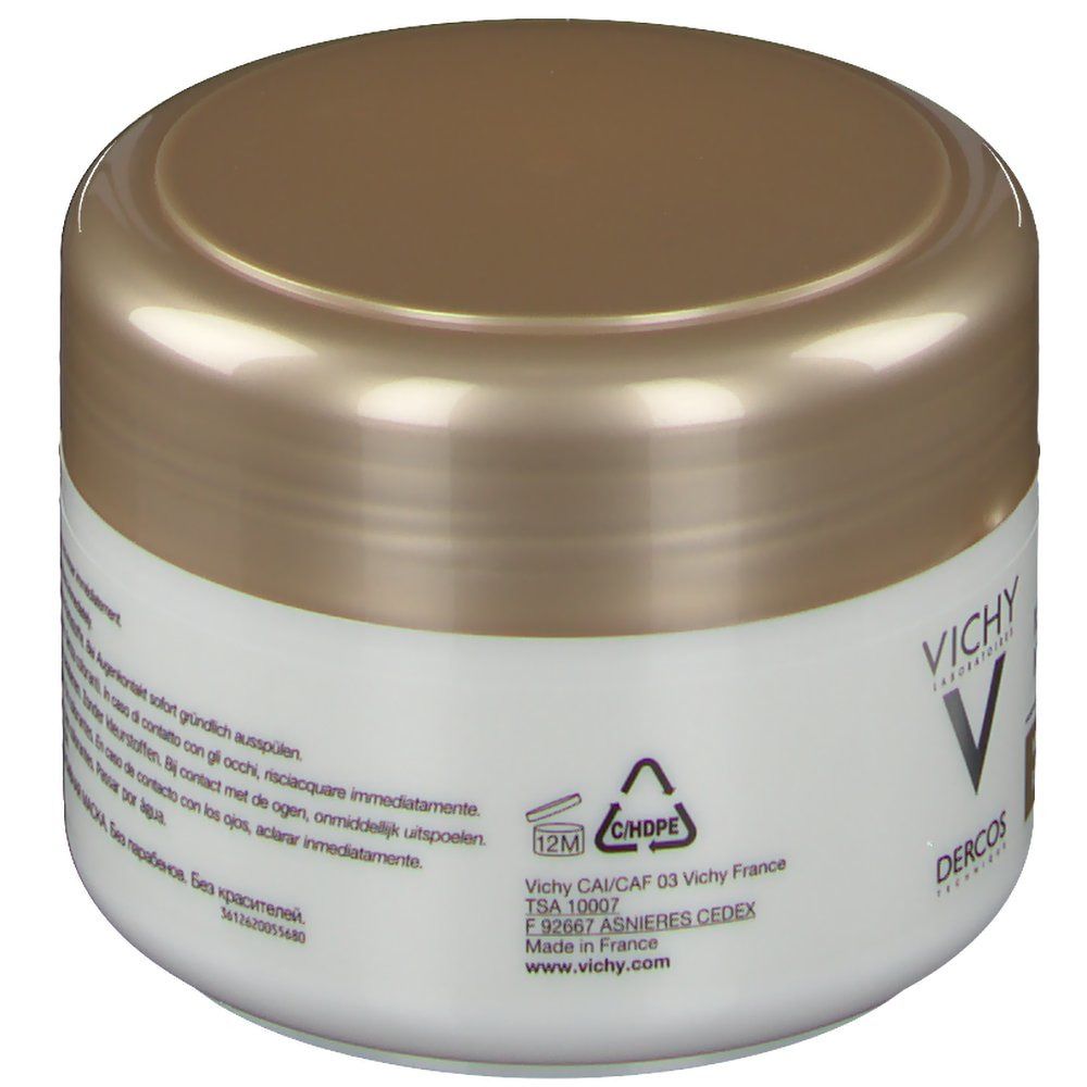 Vaso bianco con coperchio dorato. Scritta: Vichy, Dercos. Testo multilingue. Simbolo di riciclaggio.