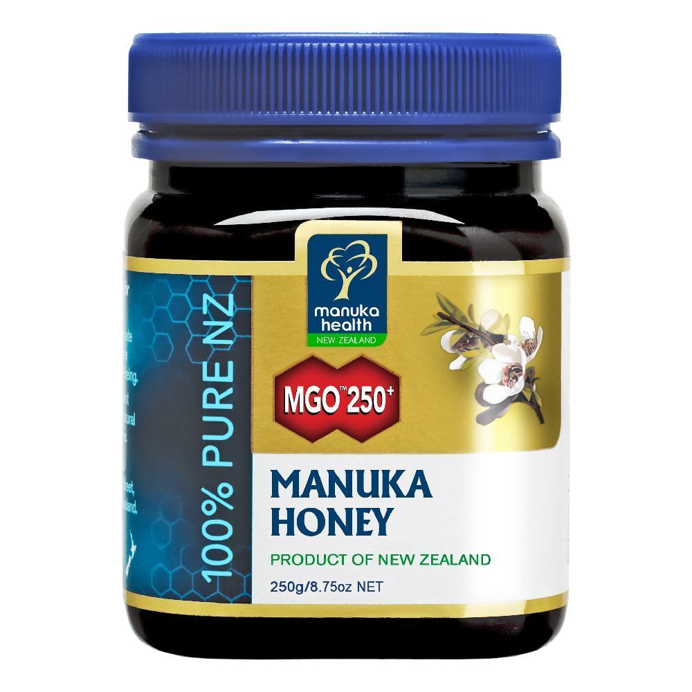 Vasetto di miele di Manuka. Etichette blu e oro con informazioni e logo. Coperchio blu.