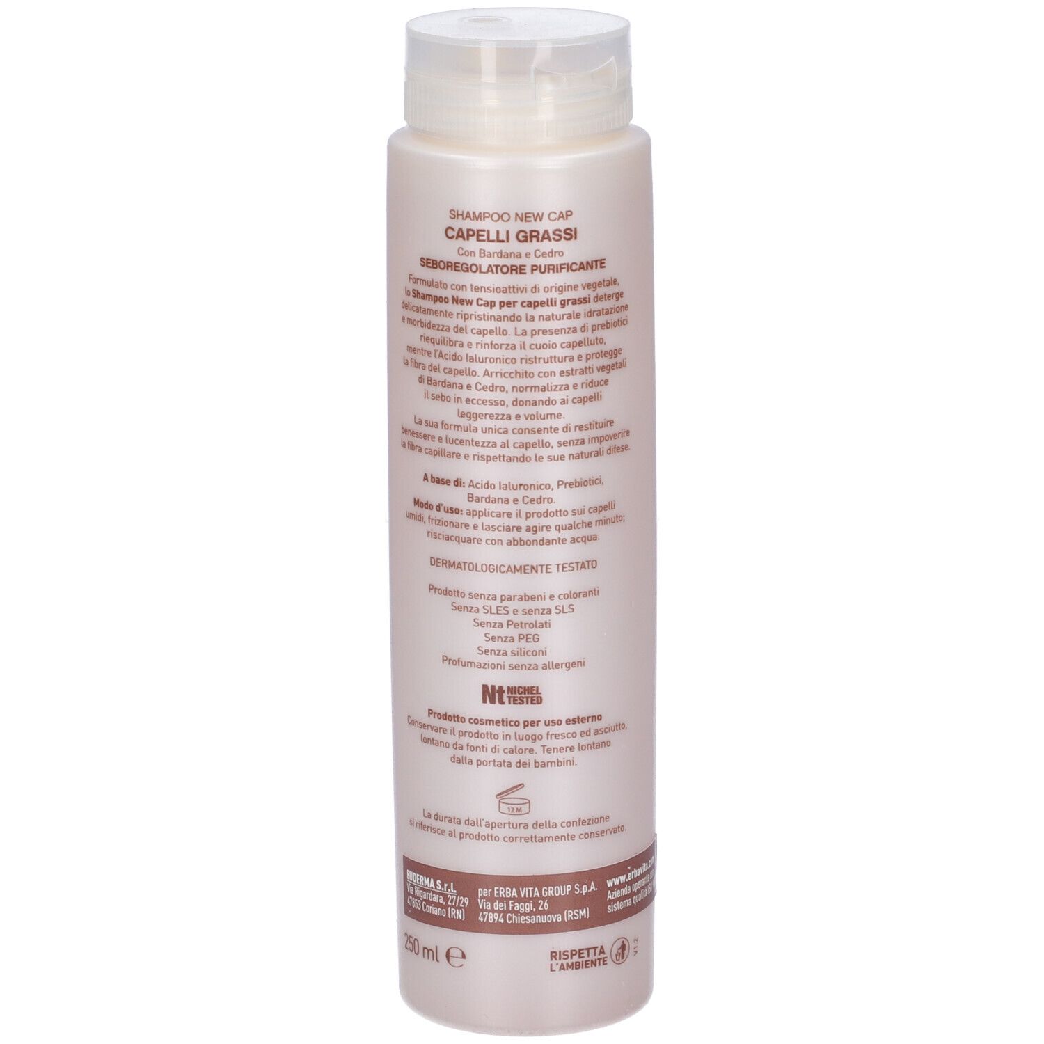 Flacone shampoo. Scritta: New Cap, Capelli Grassi. Con Bardana e Cedro. Logo Erba Vita. Flacone con tappo bianco.