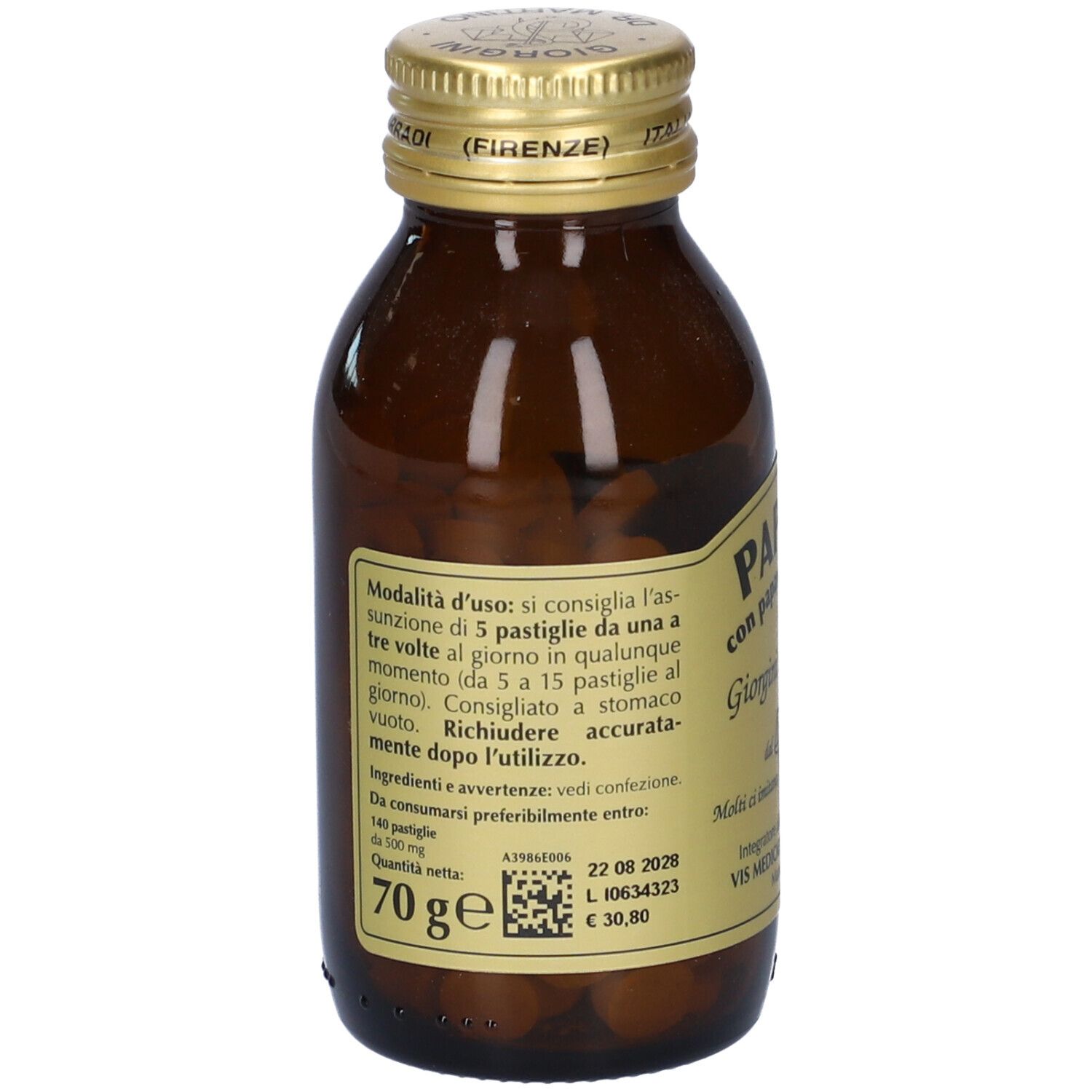 Bottiglia di vetro marrone con tappo dorato. Etichetta con informazioni sul prodotto, ingredienti e dosaggio. Compresse visibili.