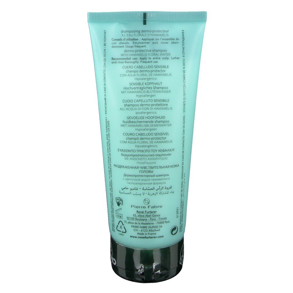 Retro del tubo di shampoo azzurro. Testo in più lingue. Tappo nero.