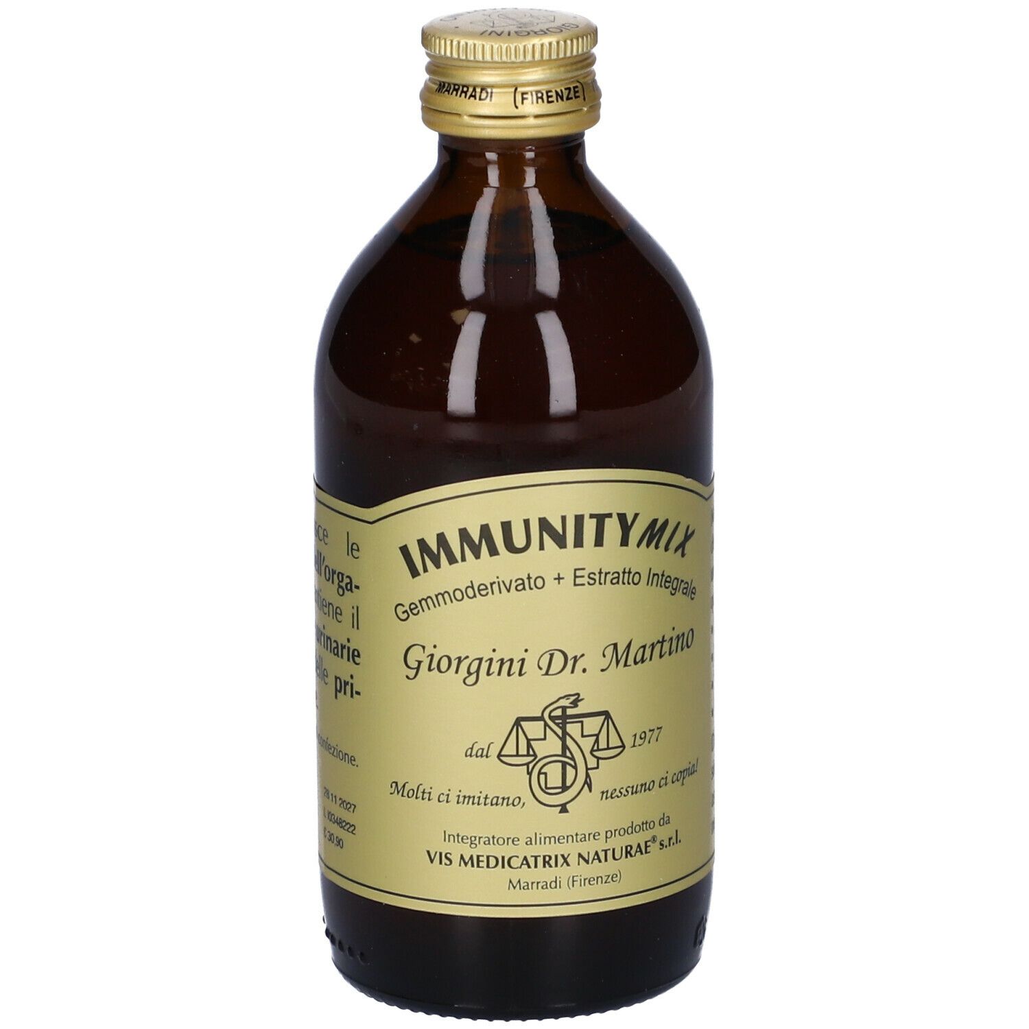 Bottiglia di vetro marrone con etichetta. Testo sugli ingredienti e l'uso.